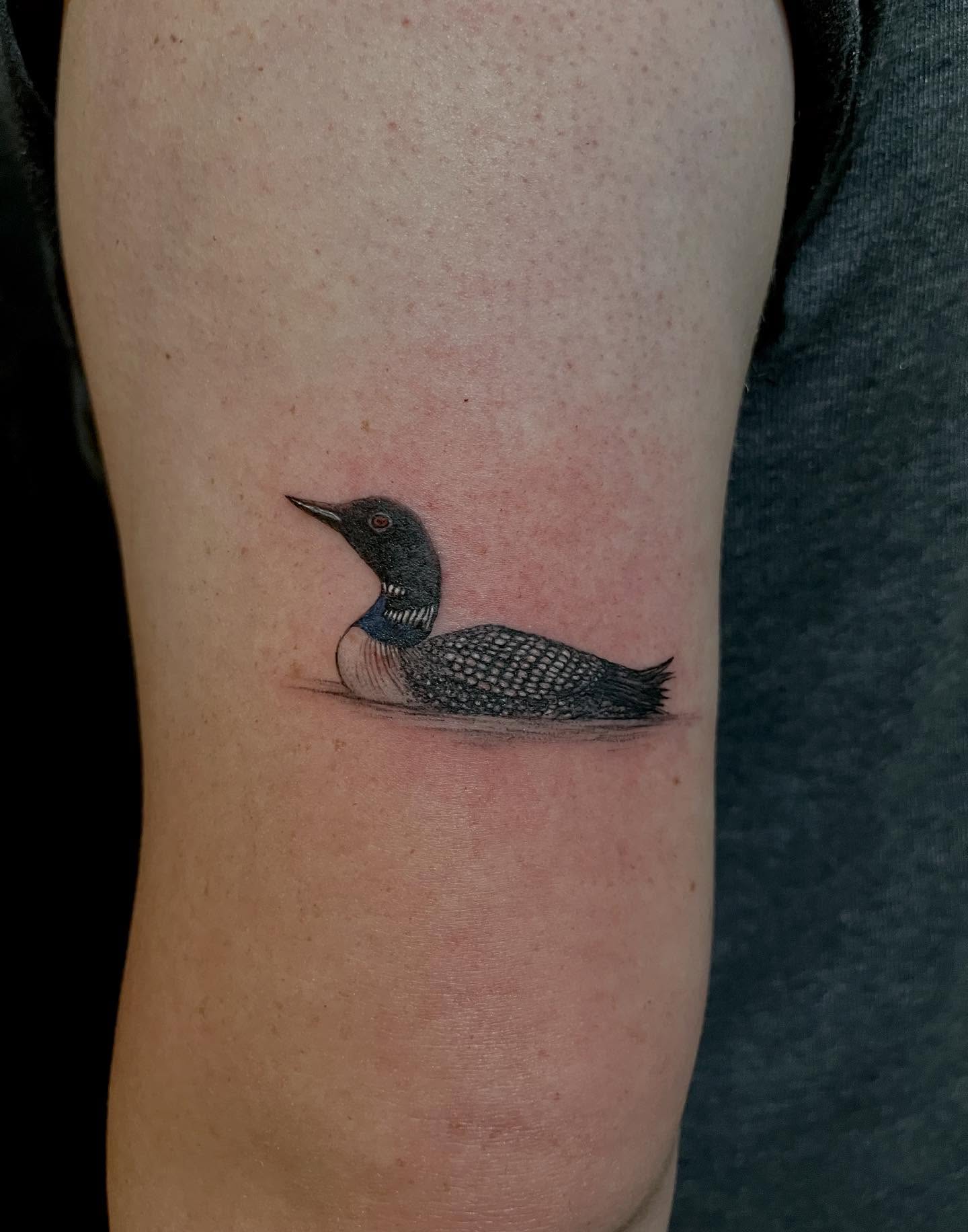 Loon realism tattoo on the forearm by Kite.Tattoo_Amber