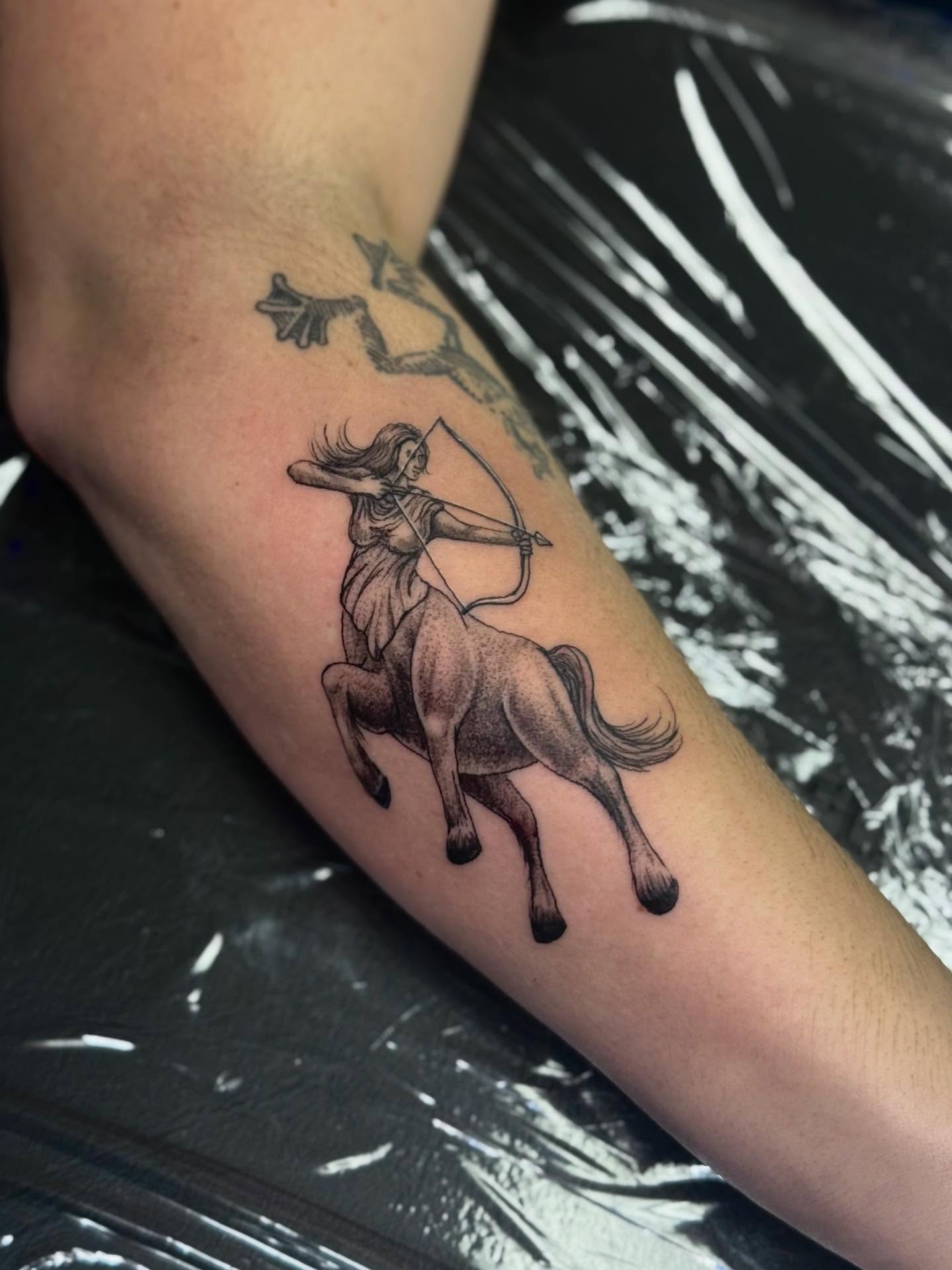 Sagittarius black and grey tattoo on the forearm by Khang🇻🇳