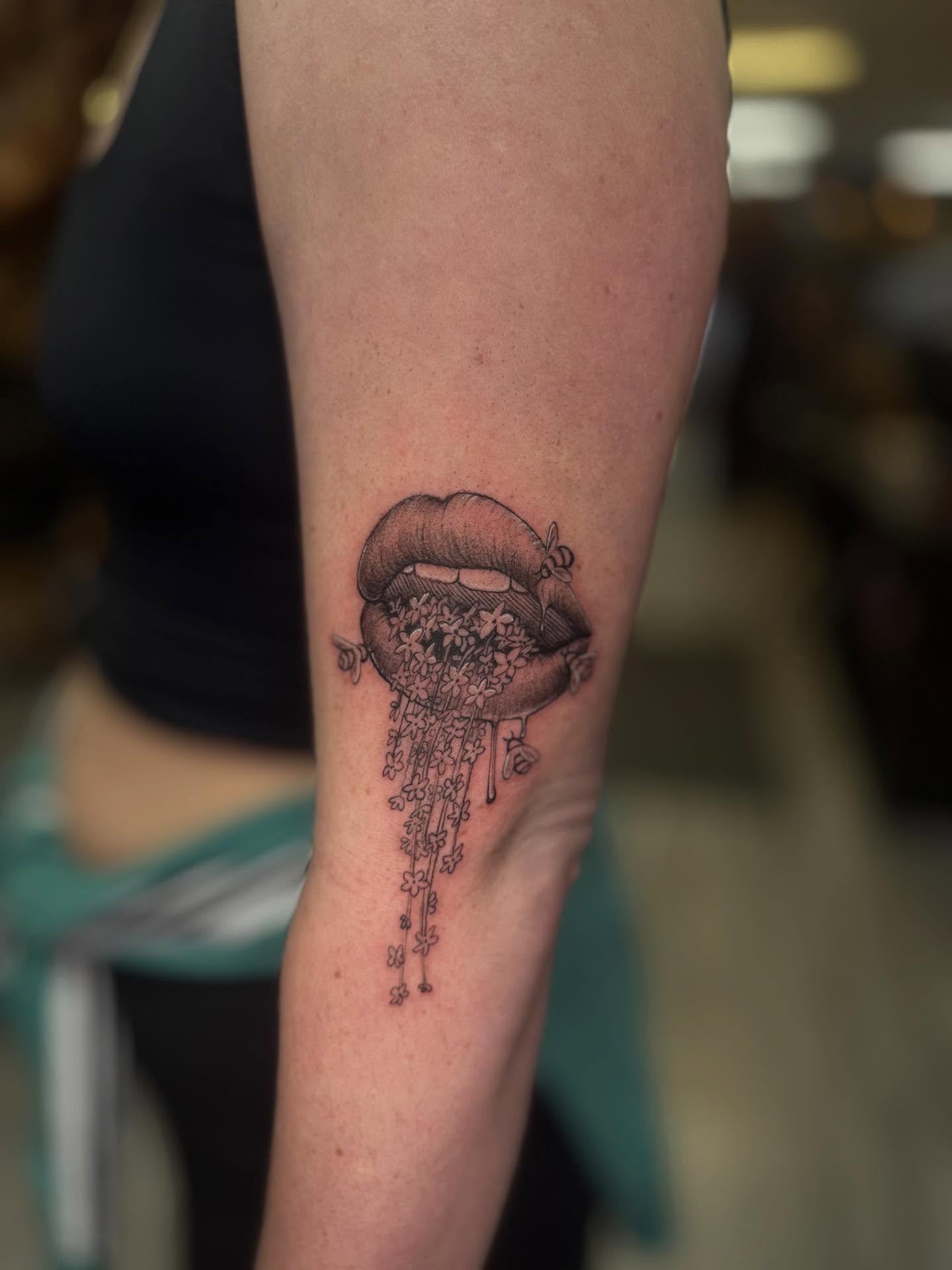 Flower petals and lips black and grey tattoo on the forearm by Khang🇻🇳