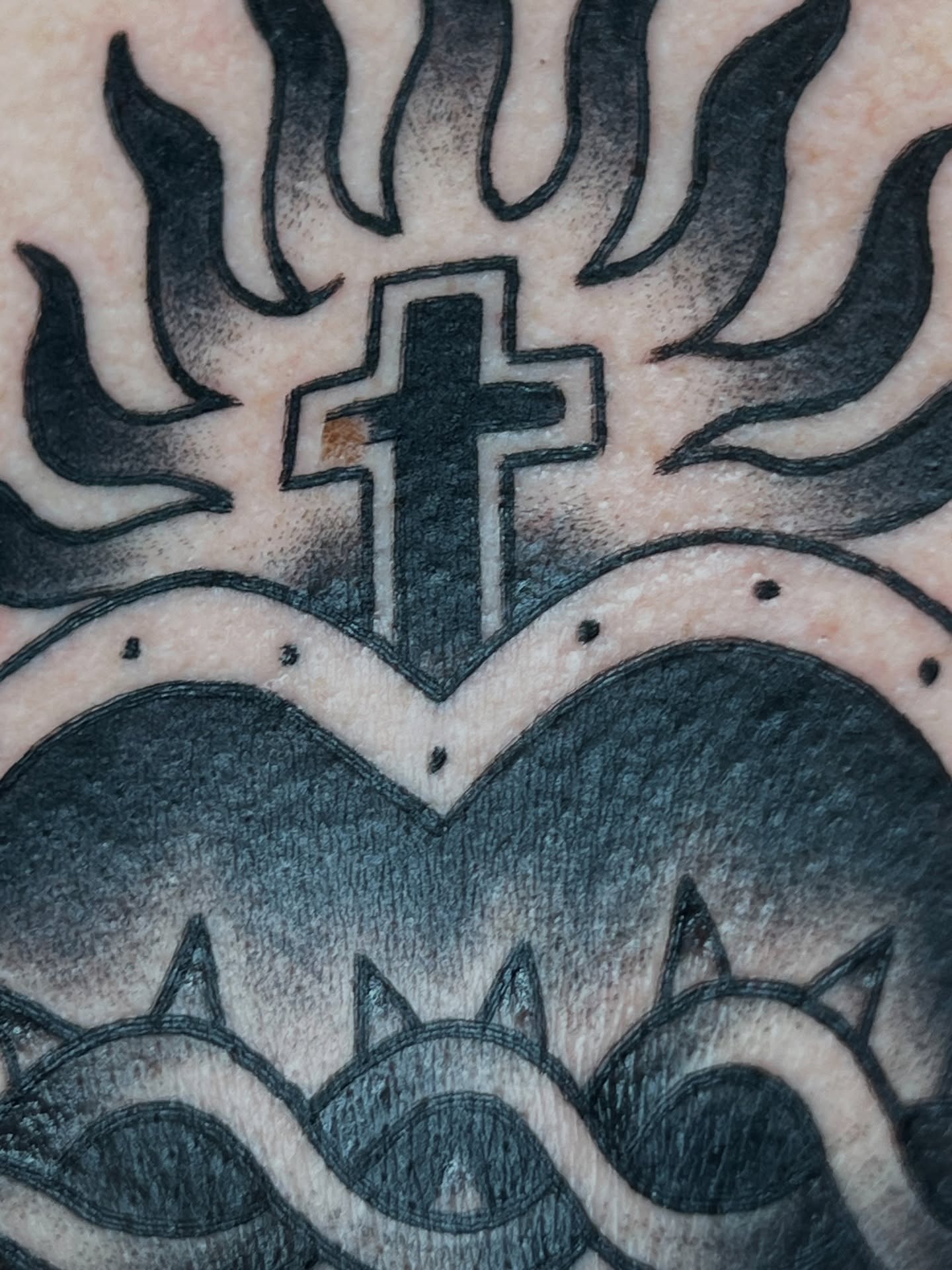 Cross with flames black and grey tattoo by Cory Miller