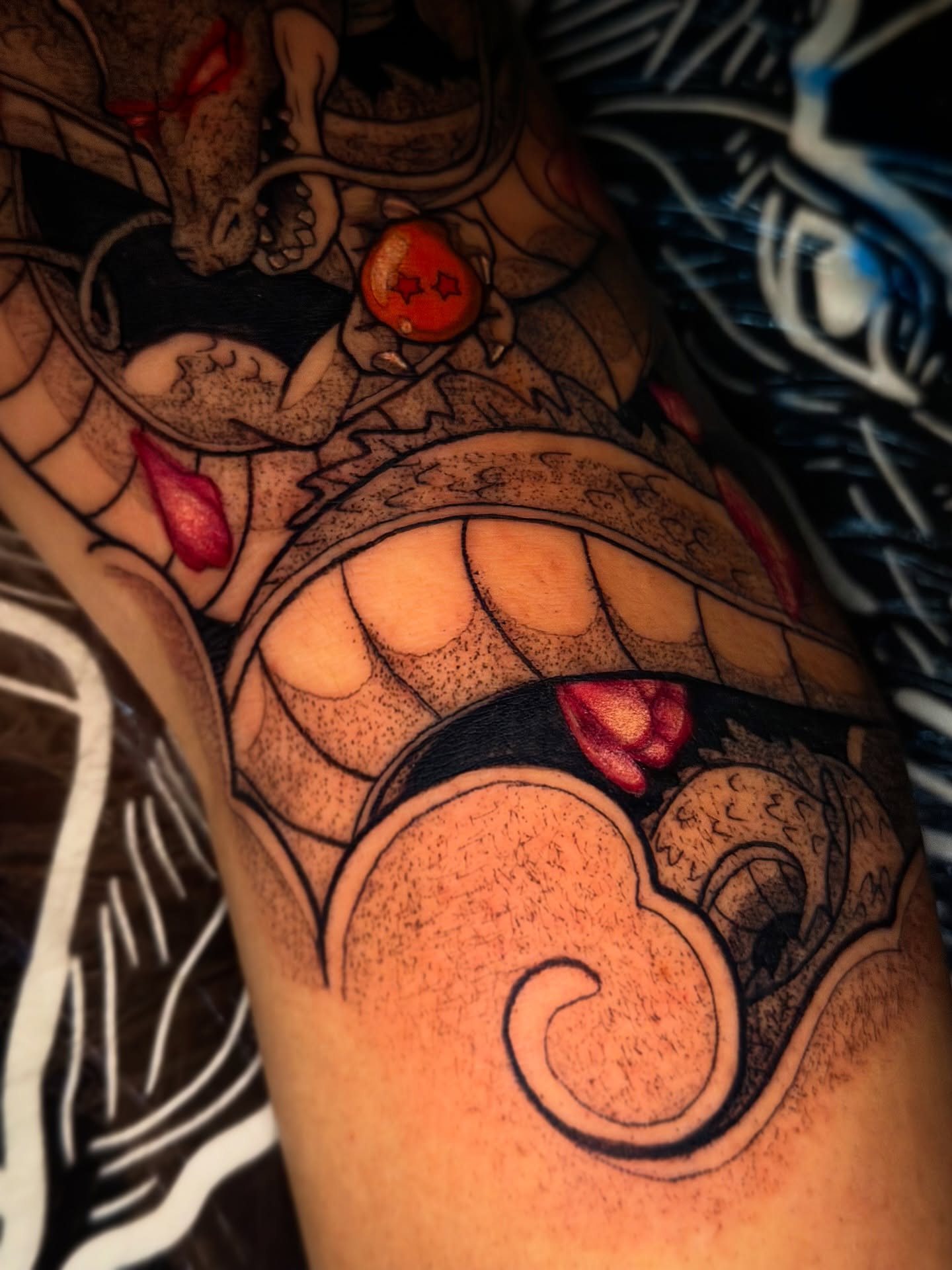 Dragon ball z black and grey tattoo on the upper arm by Aiden Madrigal