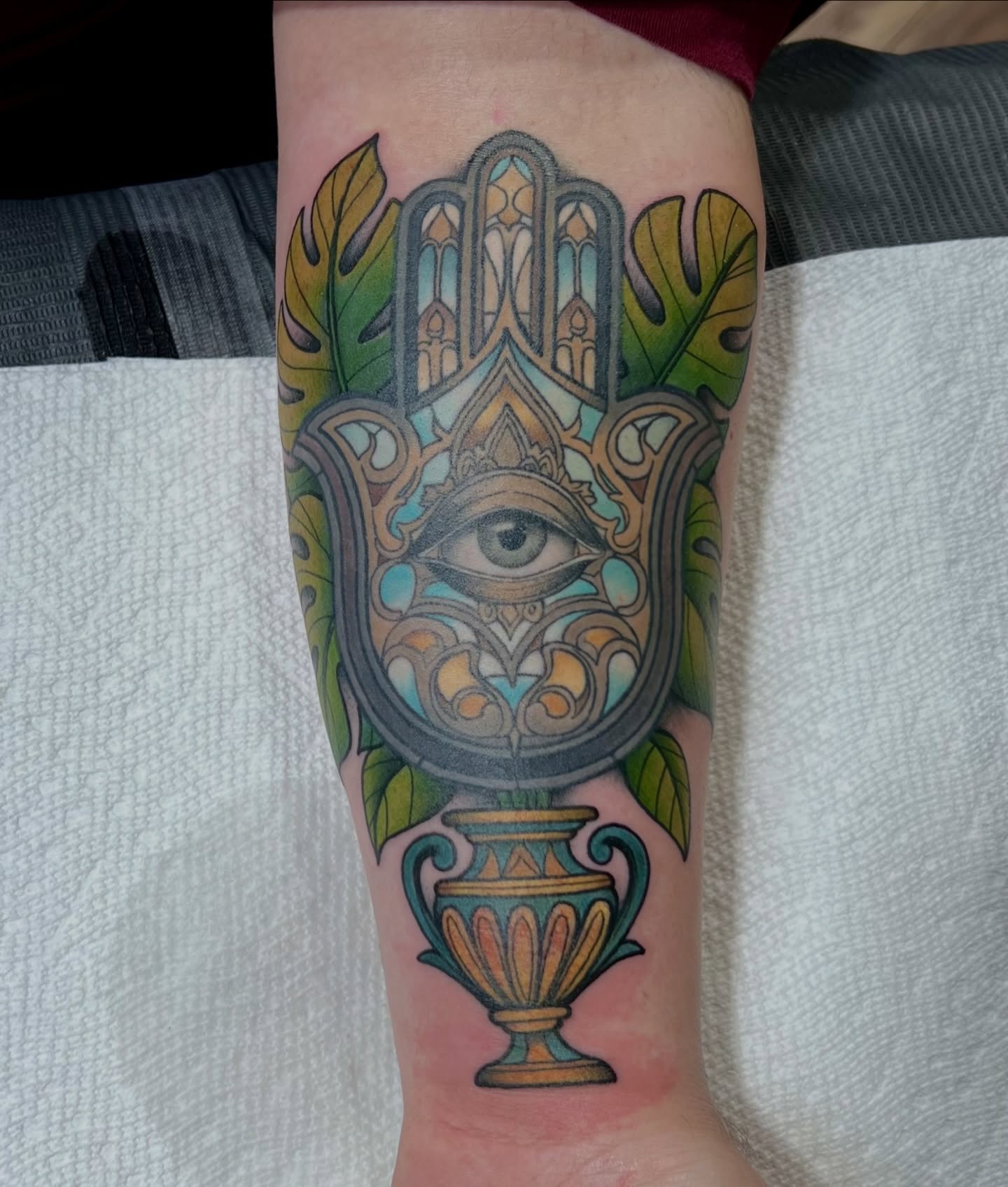 Hamsa hand geometric tattoo on the forearm by Kendall Orlando