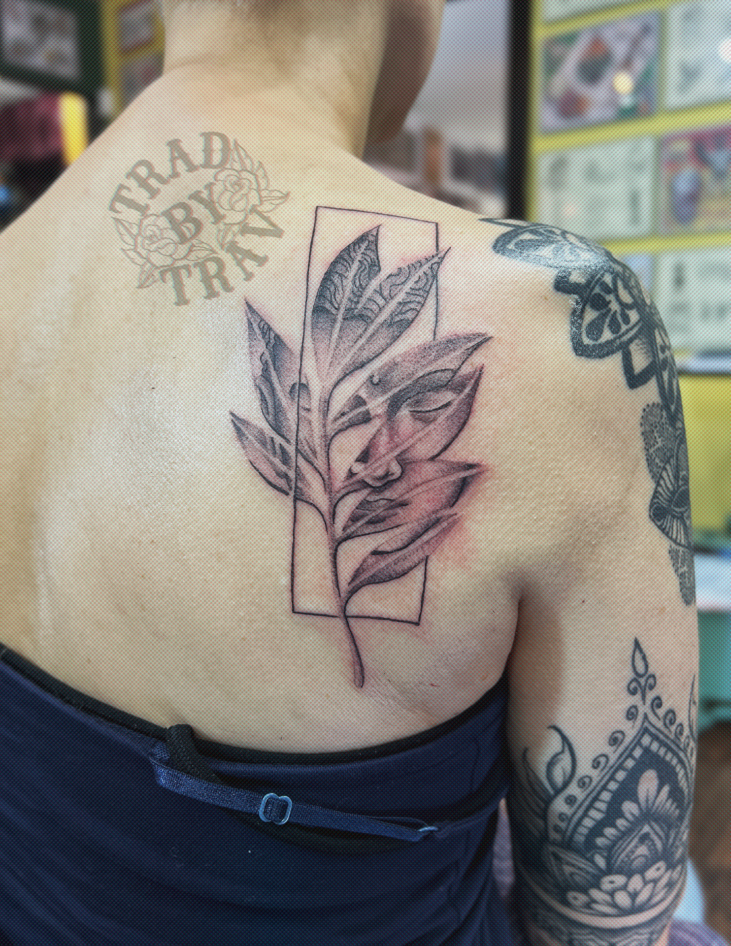 Leaf black and grey tattoo on the back by Travis B