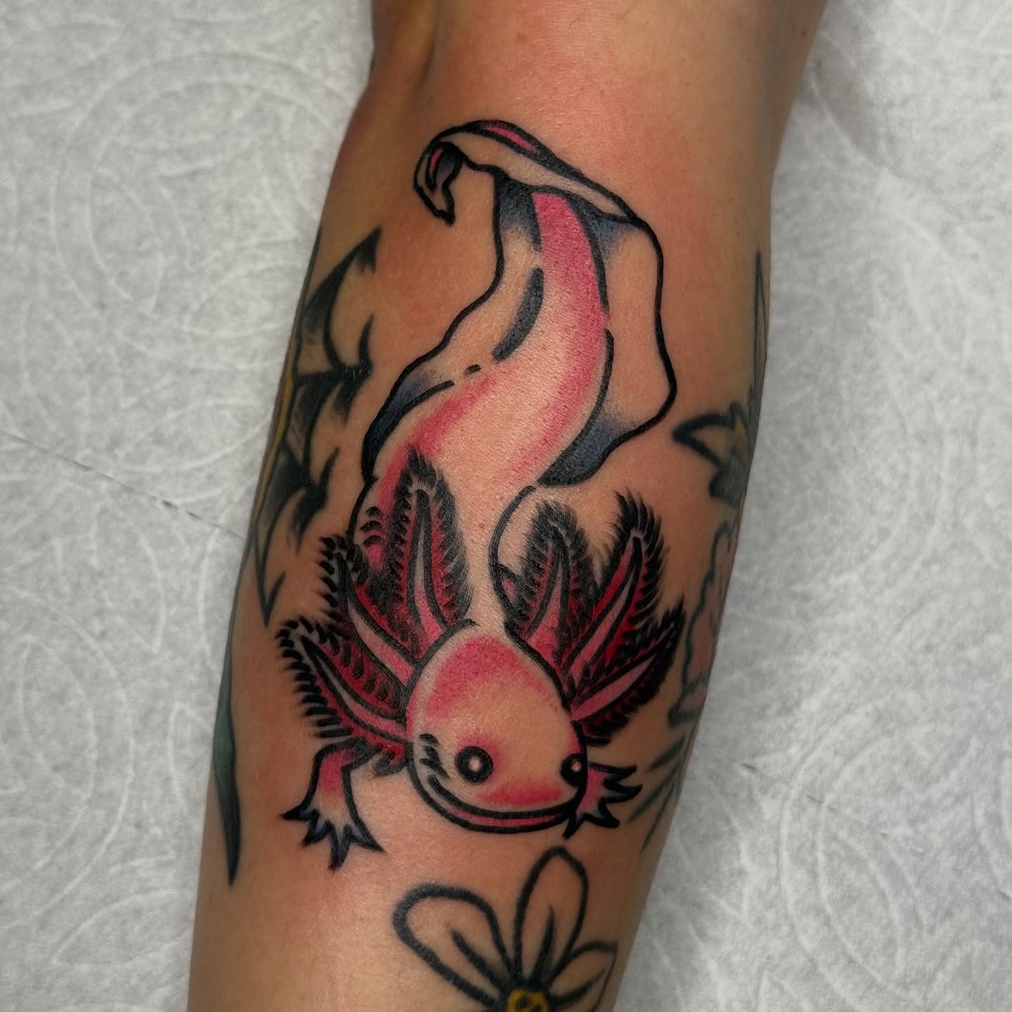 Axolotl American traditional tattoo on the forearm by Clayton - TRADITIONAL TATTOOS