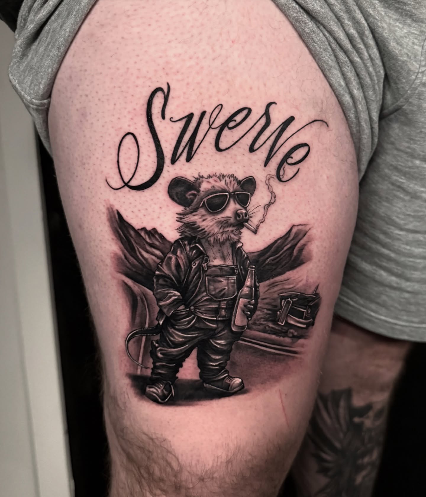 Swerve black and grey tattoo on the thigh by Chelsea Speirs