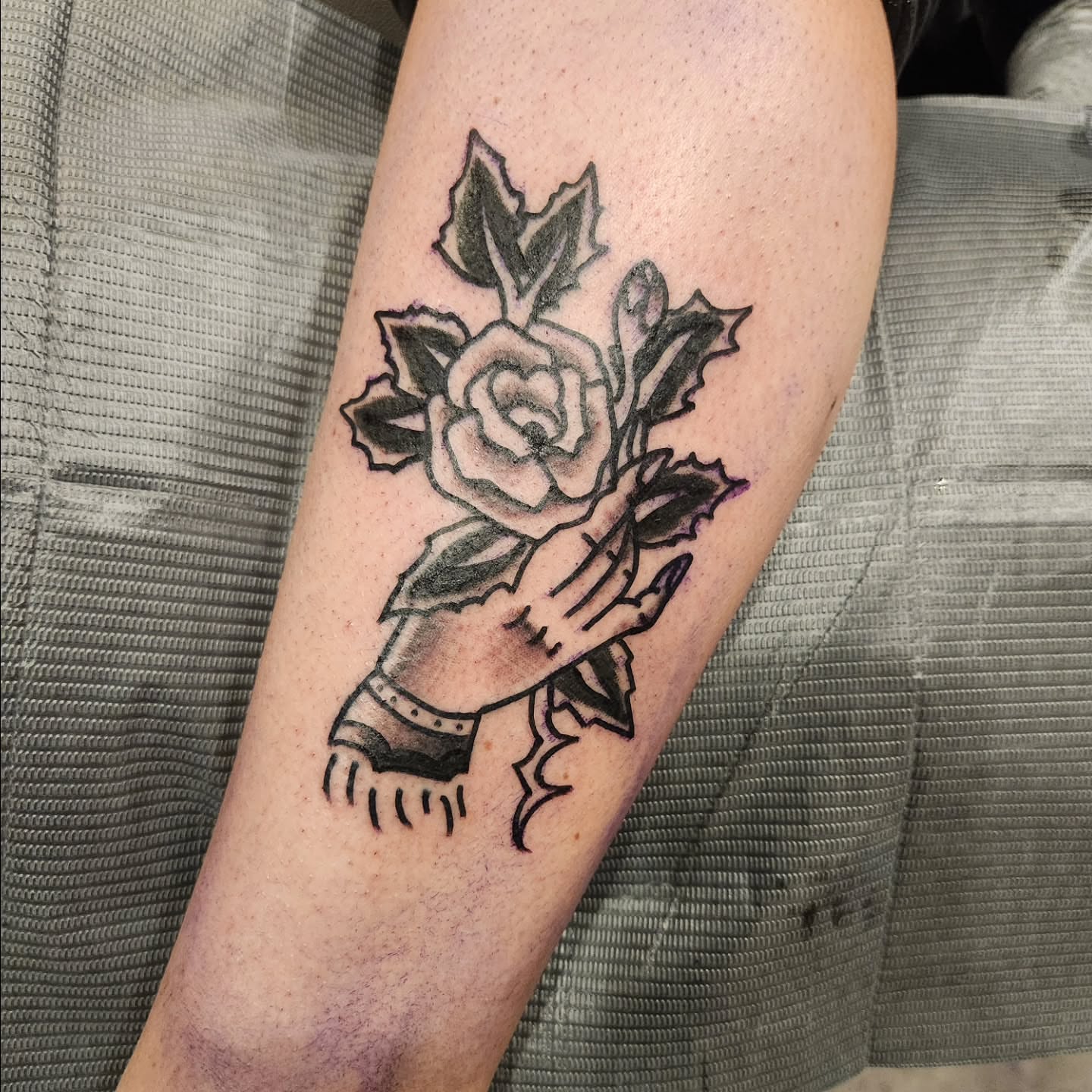 Rose and hand black and grey tattoo on the forearm by Sonya ๐ฟ๐ธ๐พ