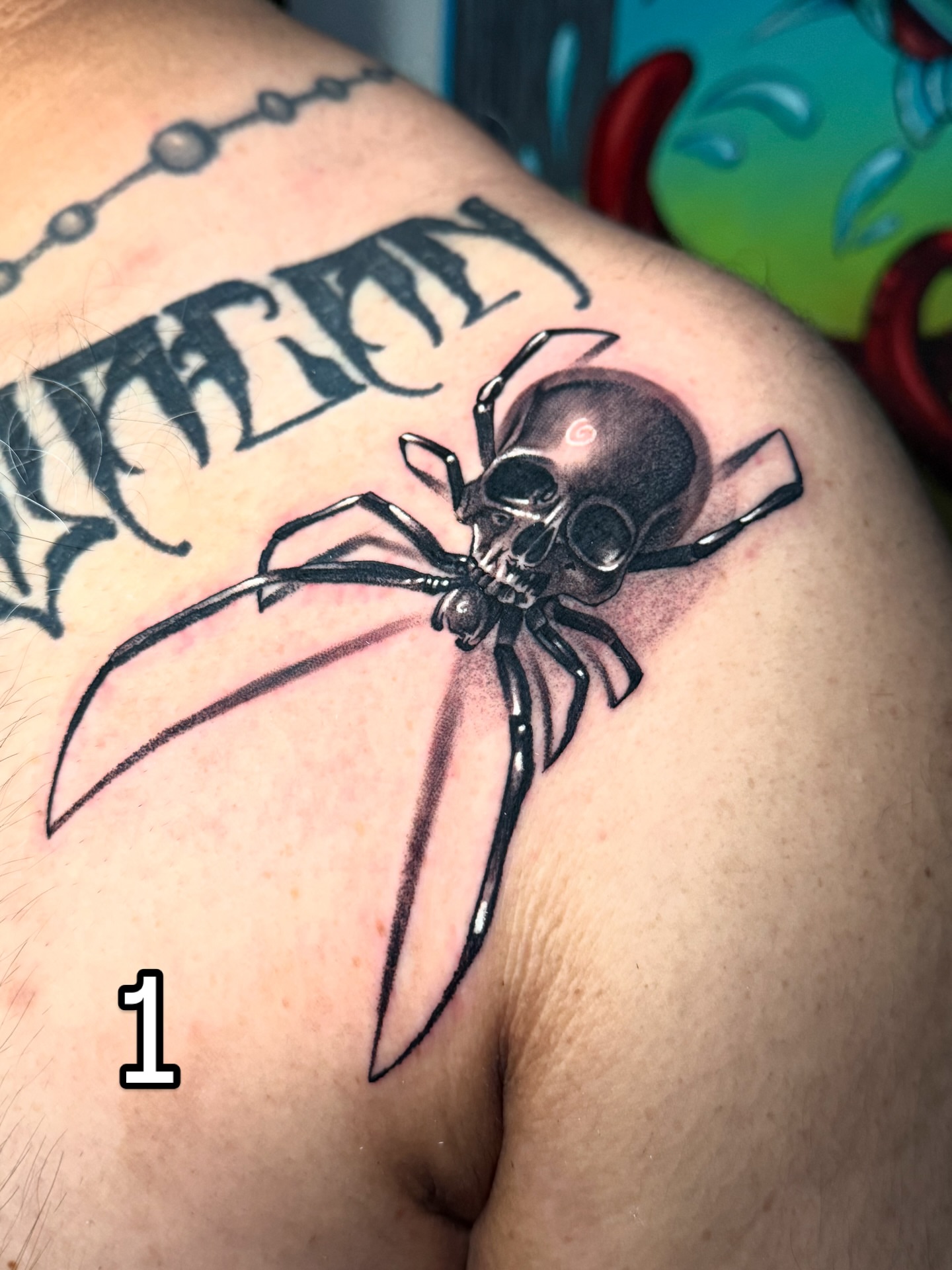 Skull spider realism tattoo on the shoulder by “Gonzo