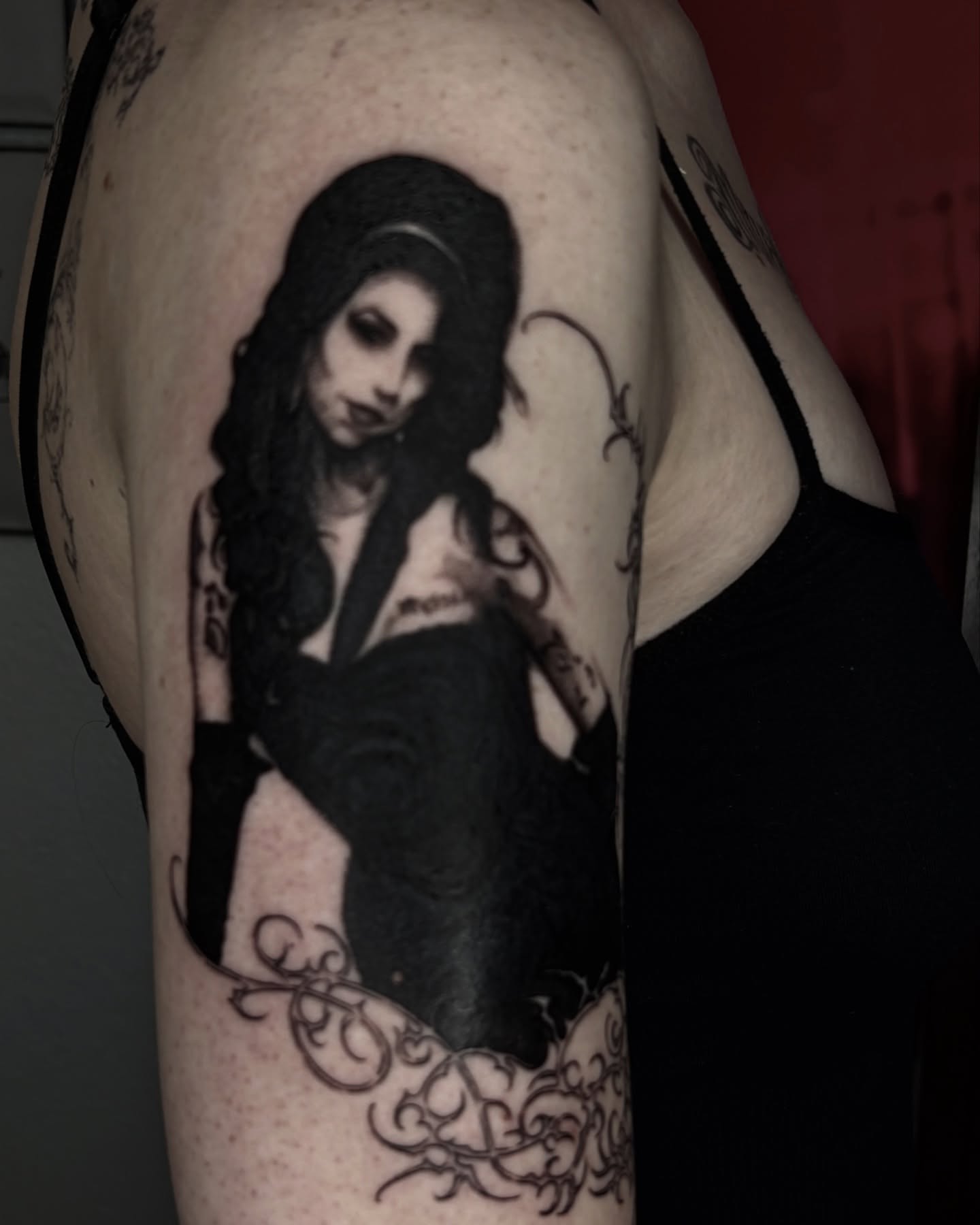 Woman with long hair dark realism tattoo on the upper arm by Silvia :)