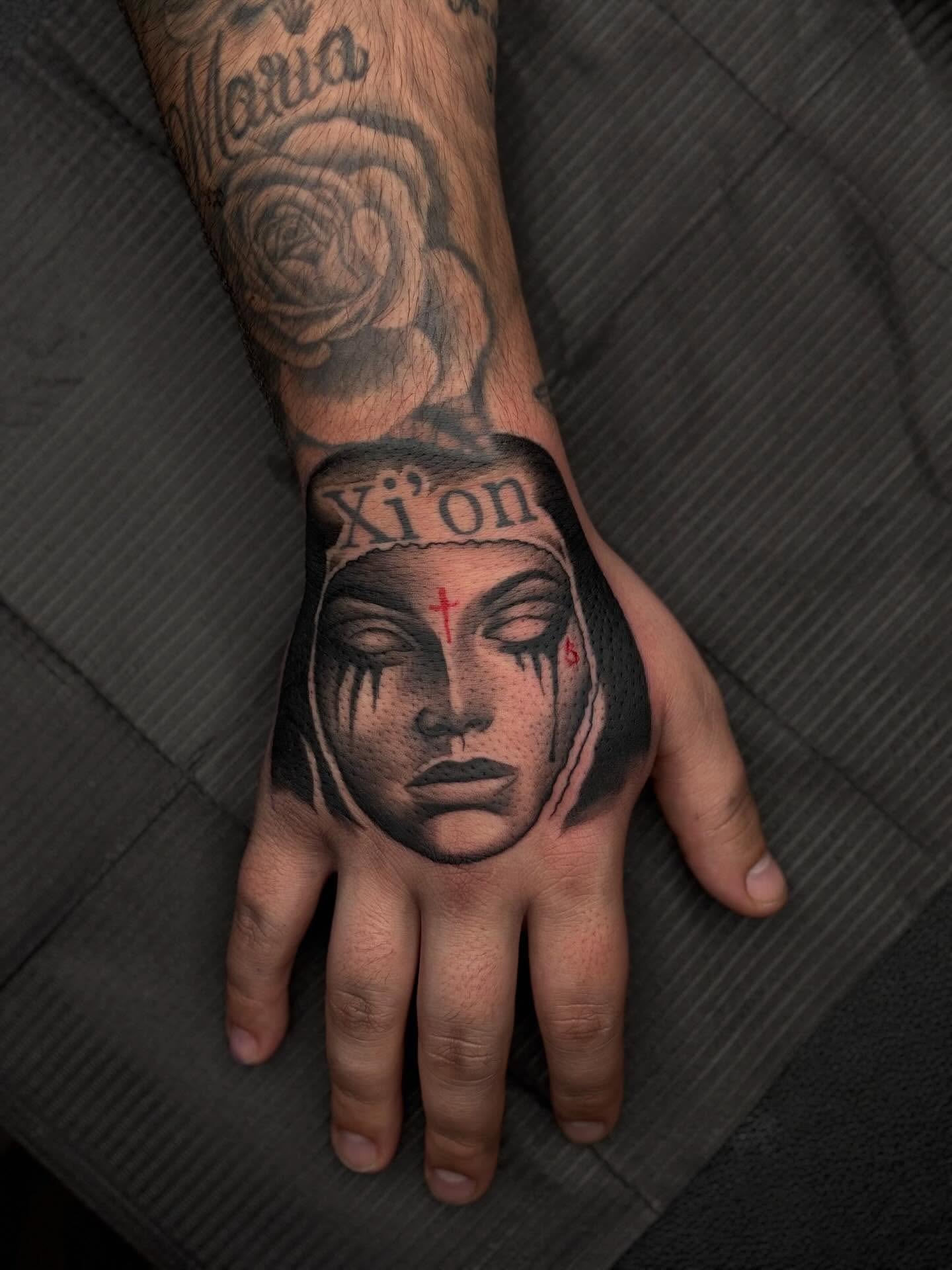Woman's face realism tattoo on the hand by Jay Daartist