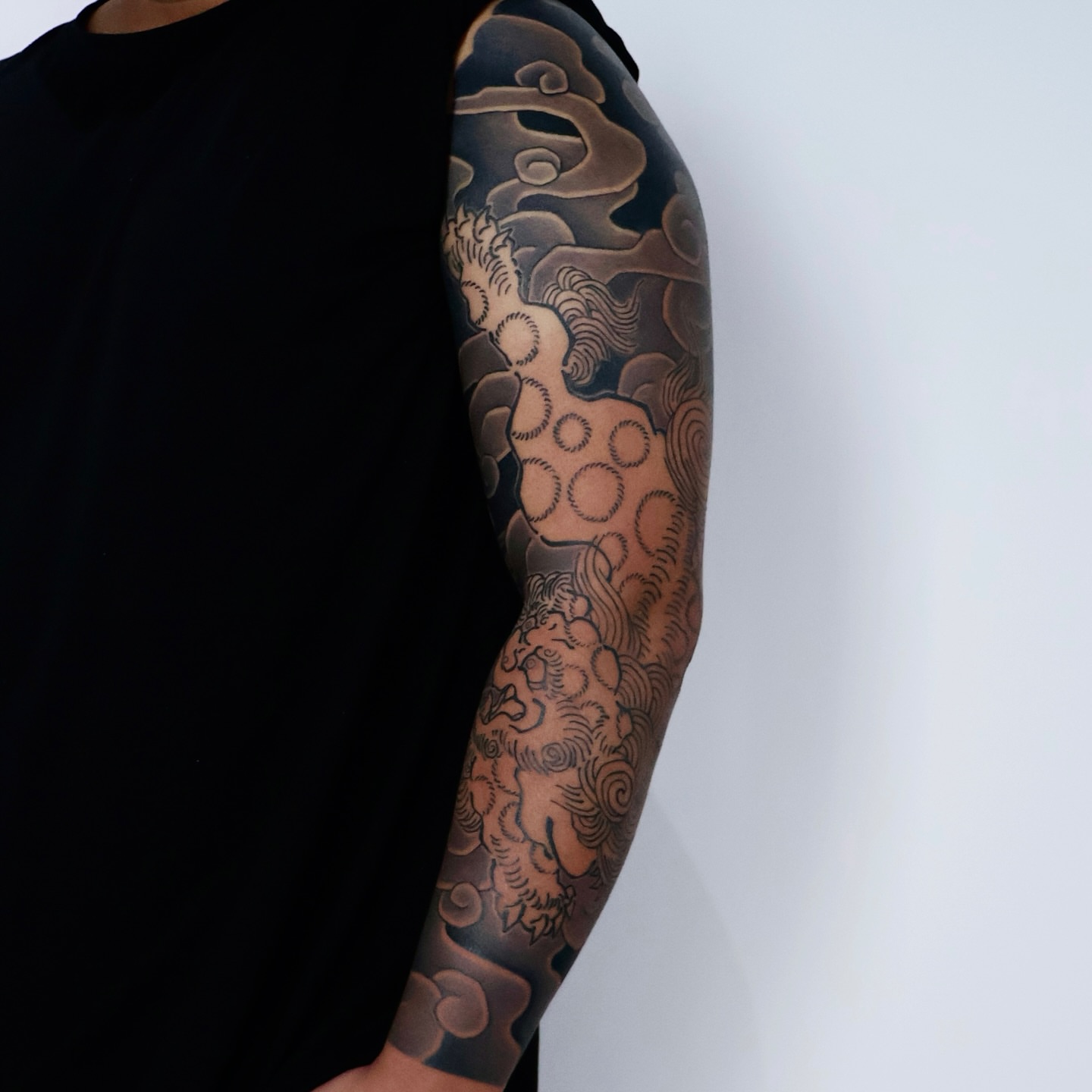 Clouds and waves japanese irezumi tattoo on the upper arm by JM kim, Melbourne, Victoria