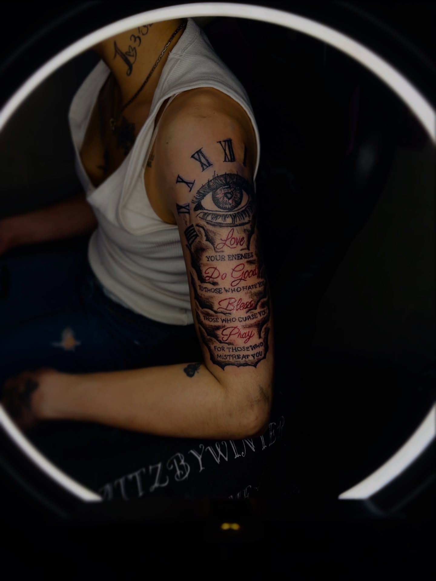 Eye and prayer text American traditional tattoo on the forearm by Winter j