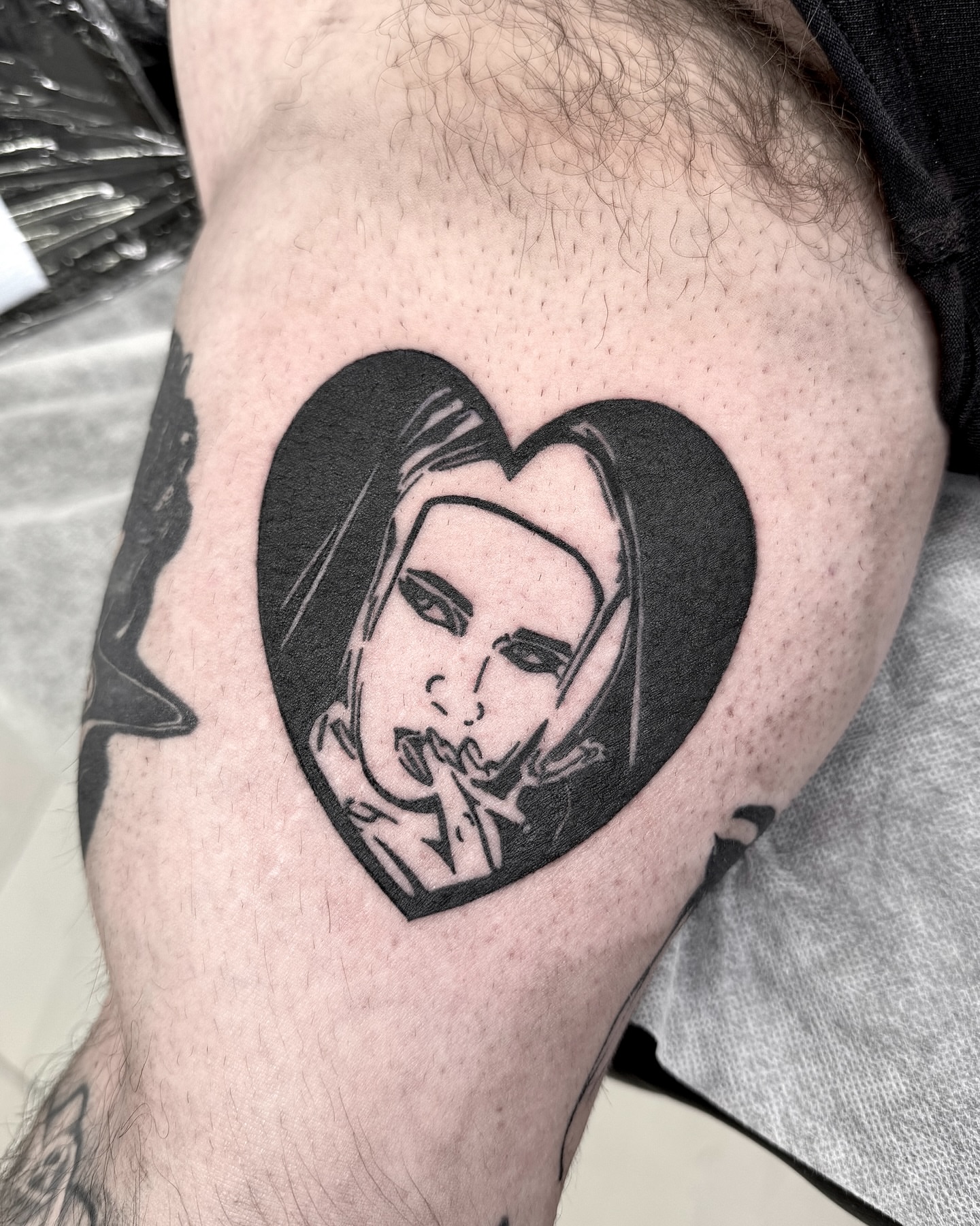 Heart with portrait black and grey tattoo on the thigh by 블랙워크 로니  blackwork roni