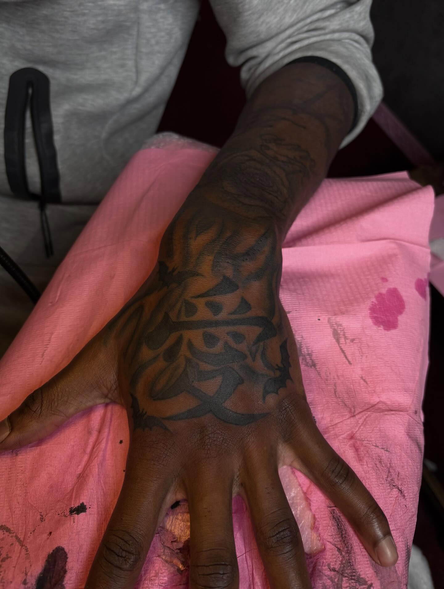 Calligraphy black and grey tattoo on the hand by Barbinks Studio🎀