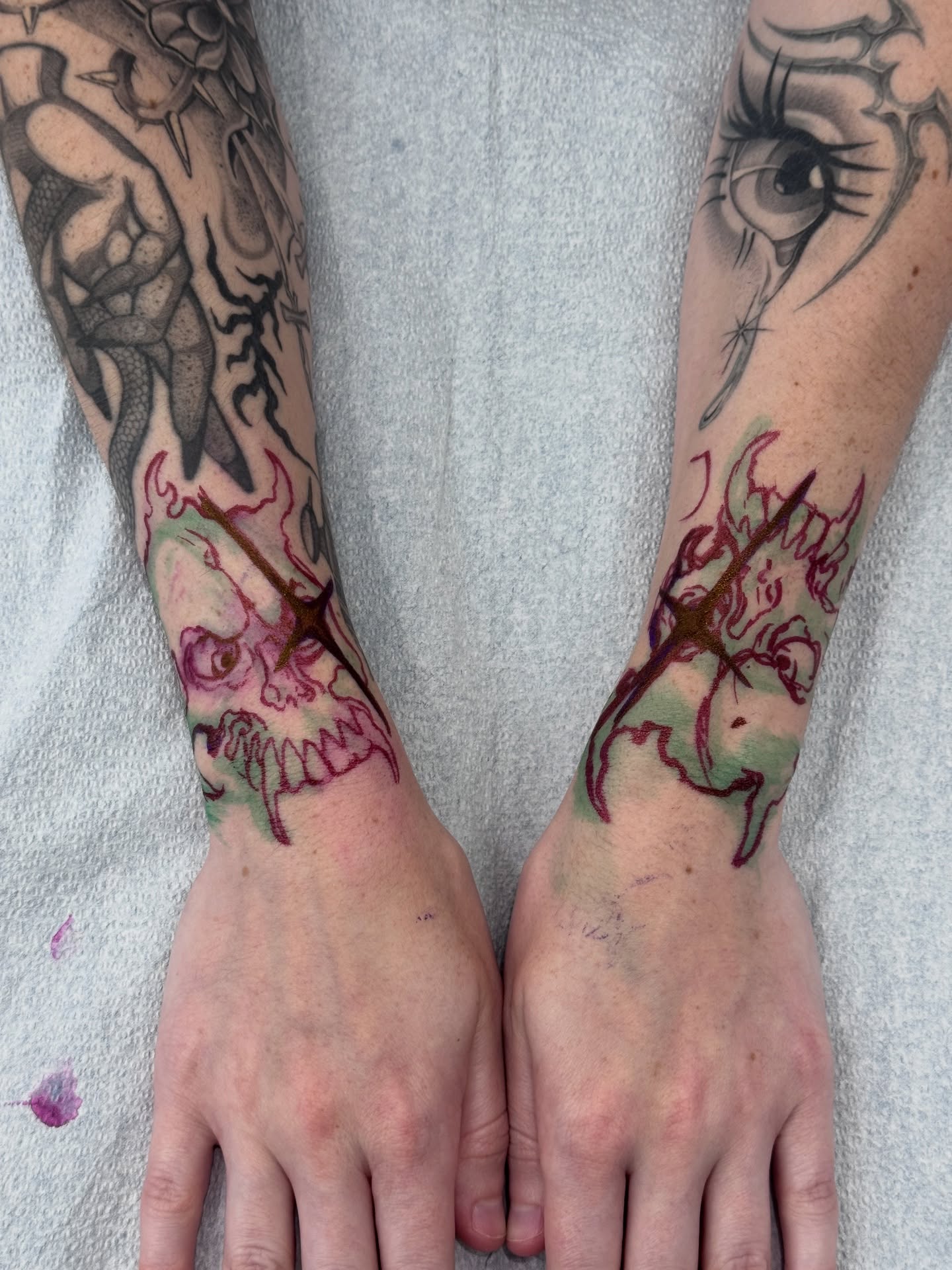 Skull and flame neo-traditional tattoo on the forearm by ella
