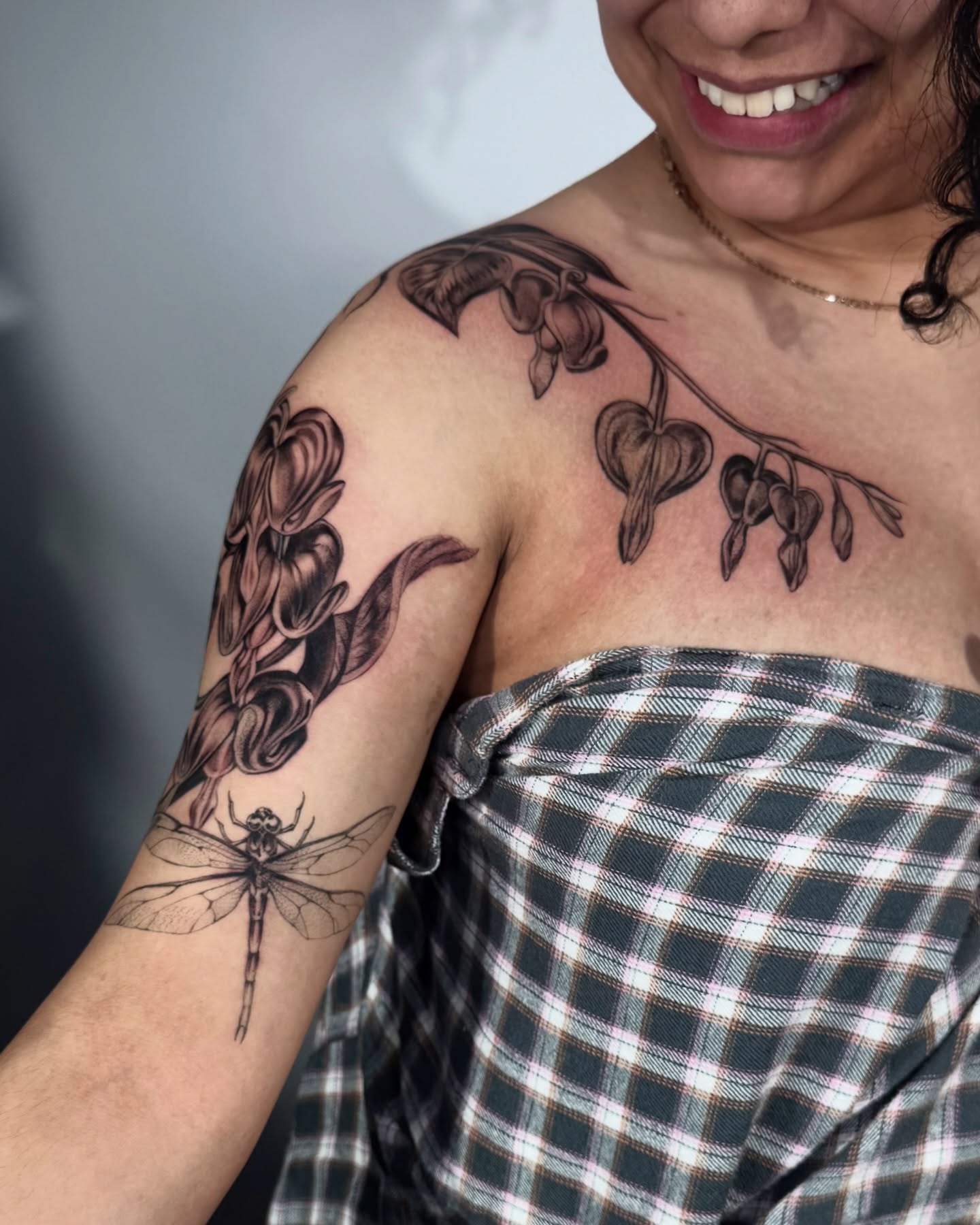 Dragonfly and flowers black and grey tattoo on the shoulder by Tattoos.byDahlia, Austin, Texas