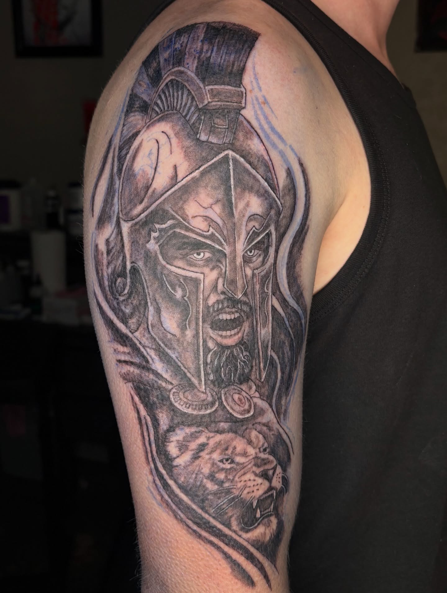 Warrior with helmet realism tattoo on the shoulder by Evan Chastain