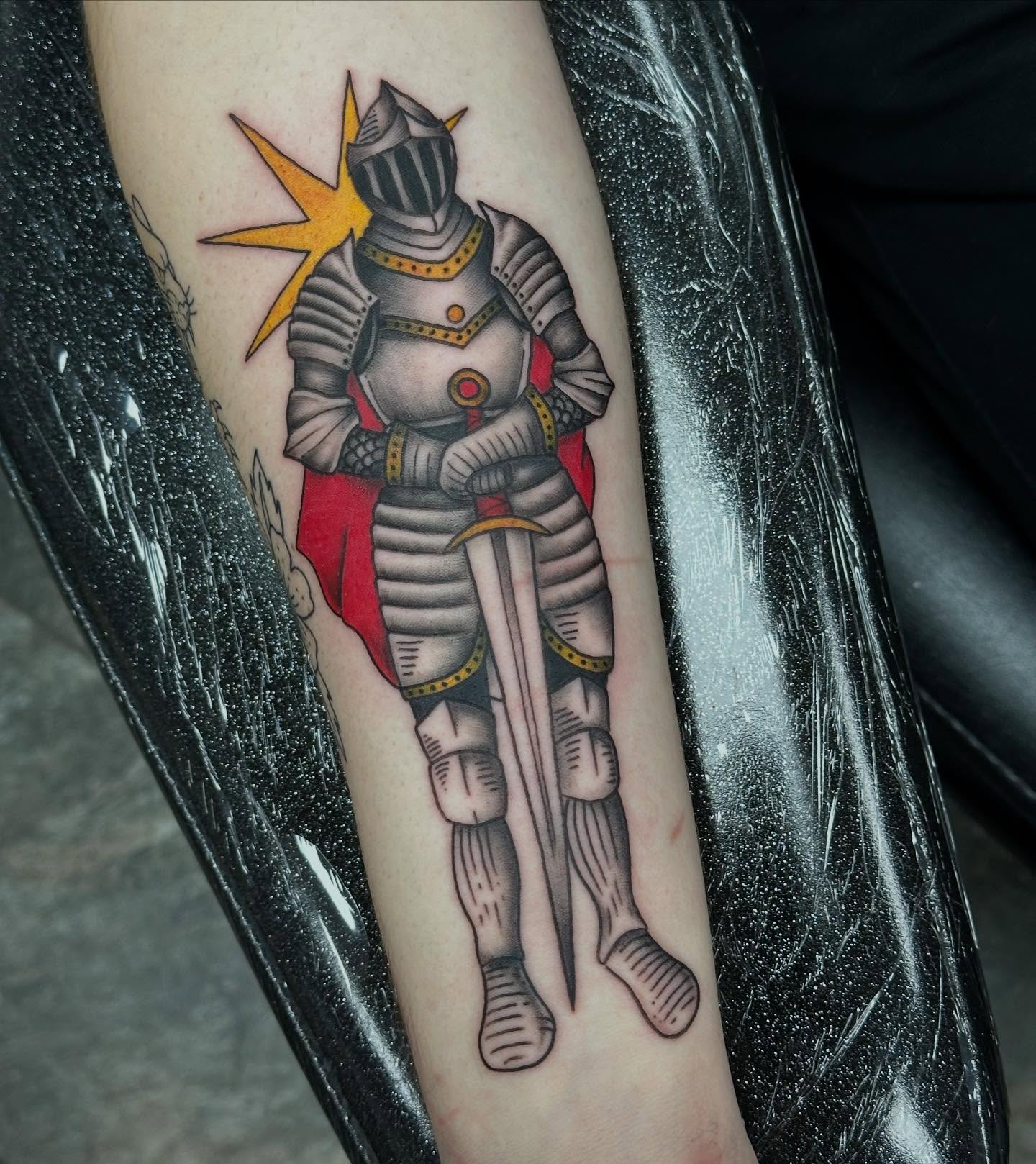 Knight in armor American traditional tattoo on the forearm by Olivia Norbert