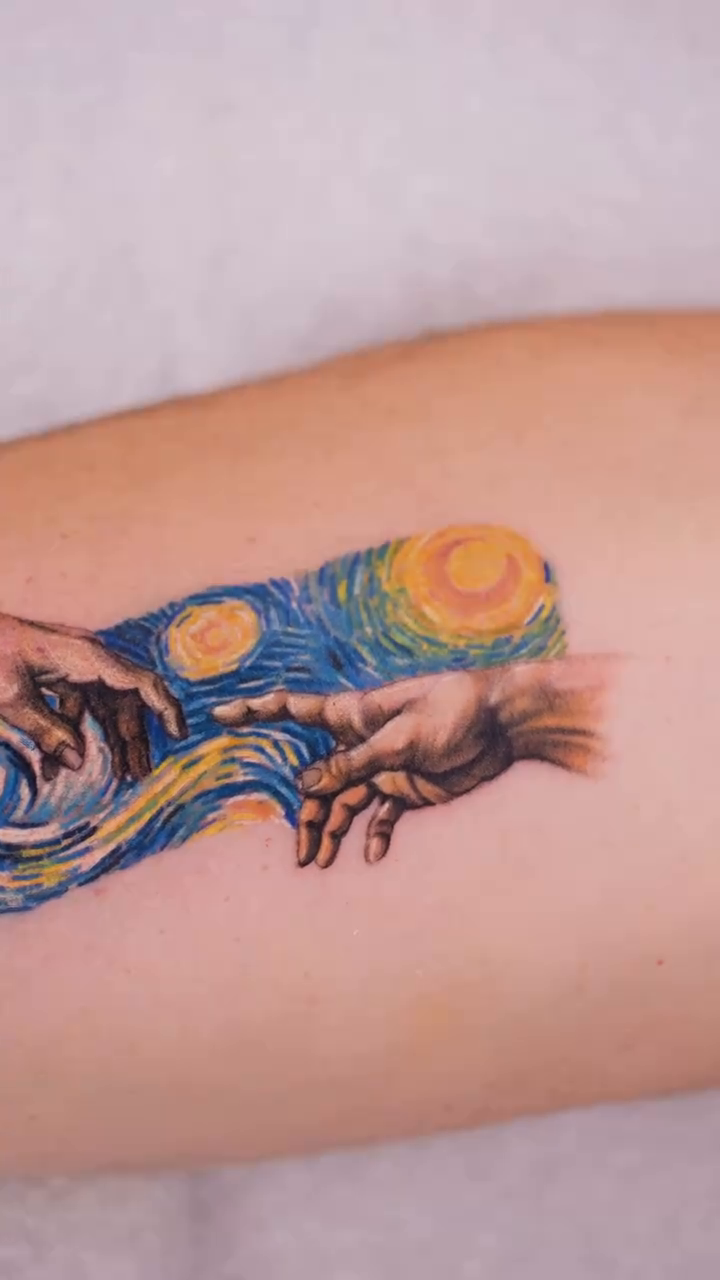 Hands and sky realism tattoo by Eva Liu