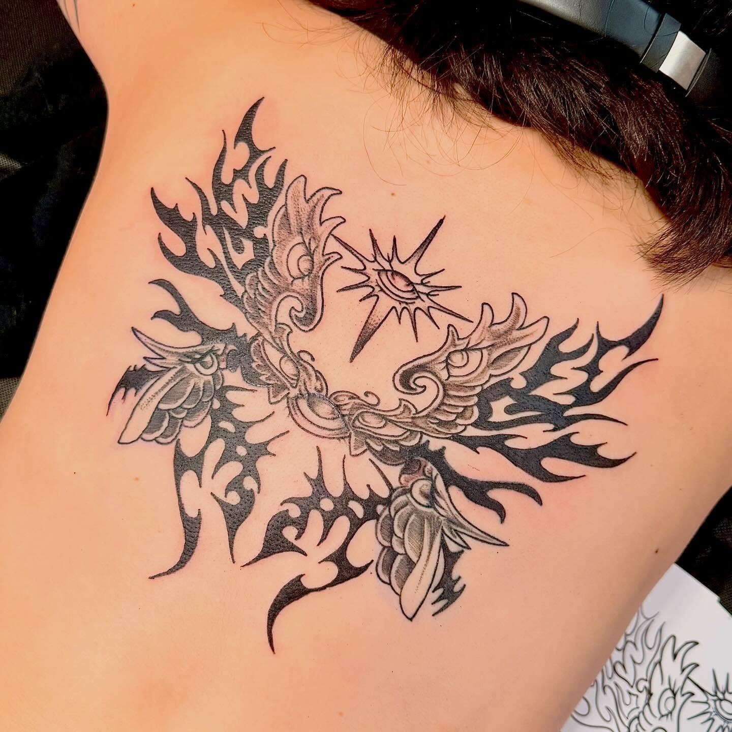 Flaming phoenix tribal tattoo on the back by Emily K Lingg