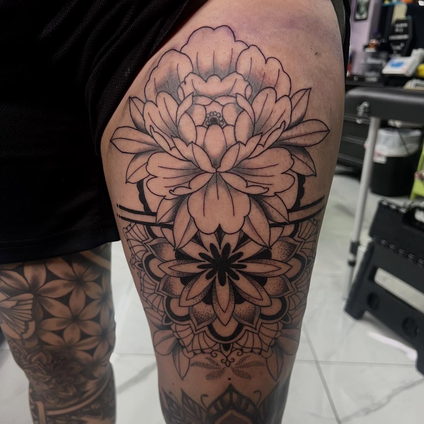 Floral mandala geometric tattoo on the thigh by Kahlan ⍟