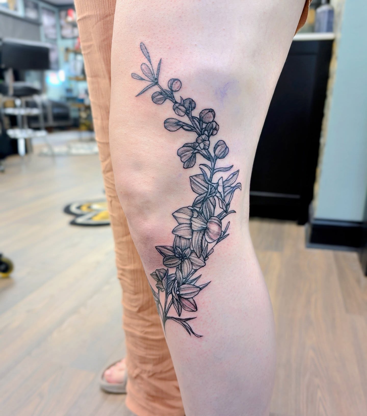Flower vine black and grey tattoo on the forearm by Devon Ward, Portland, Oregon