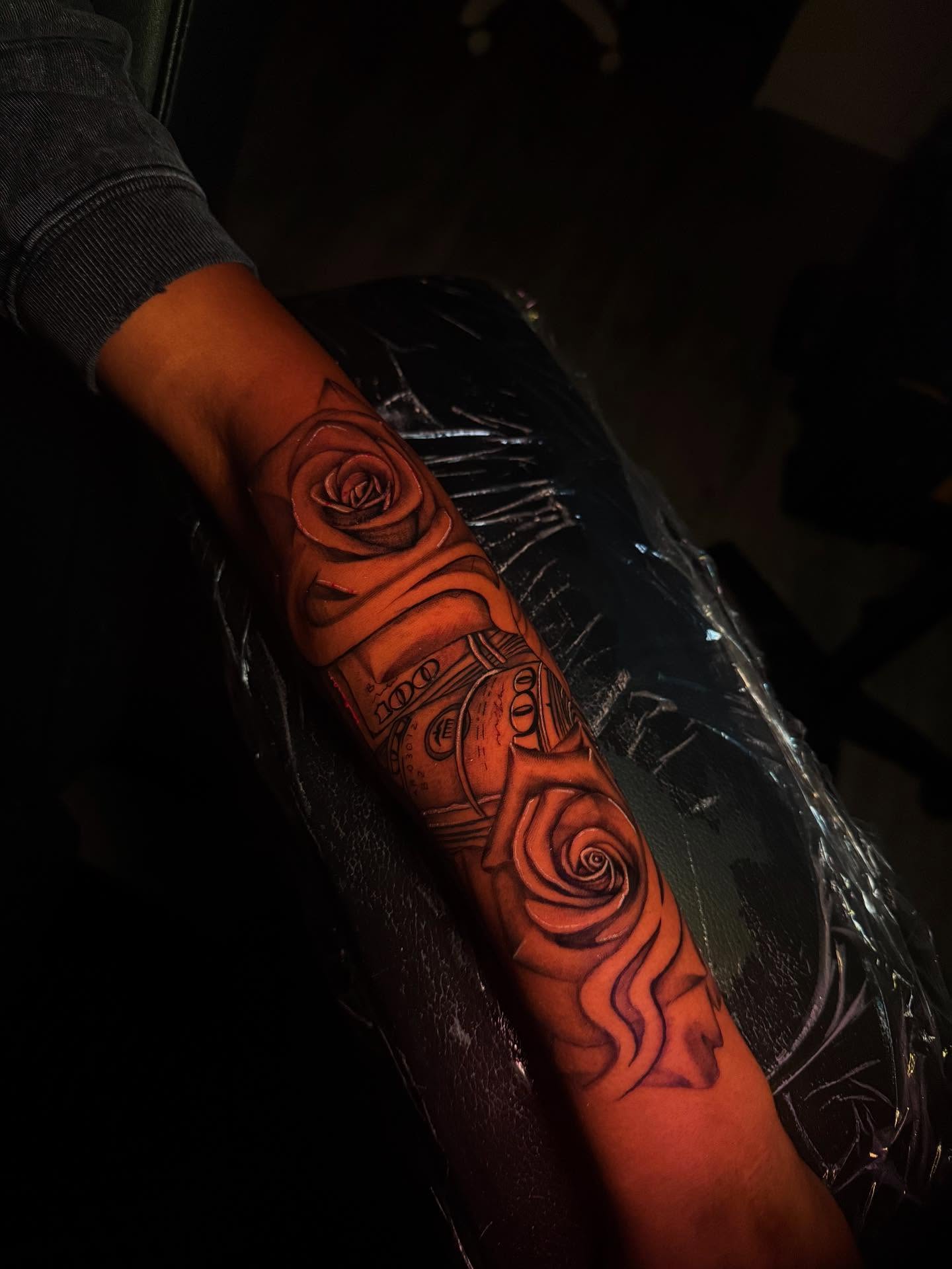 Roses and clock realism tattoo on the forearm by The Ink Guru.