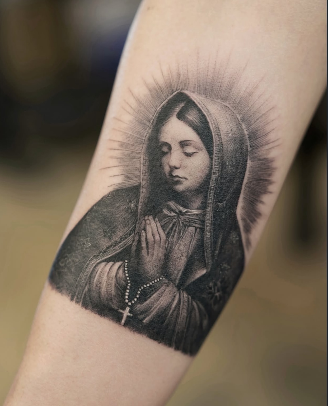 Religious figure realism tattoo on the forearm by Gen Li