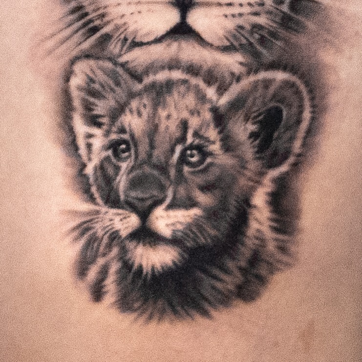 Lion cub and adult lion realism tattoo by James Jurado