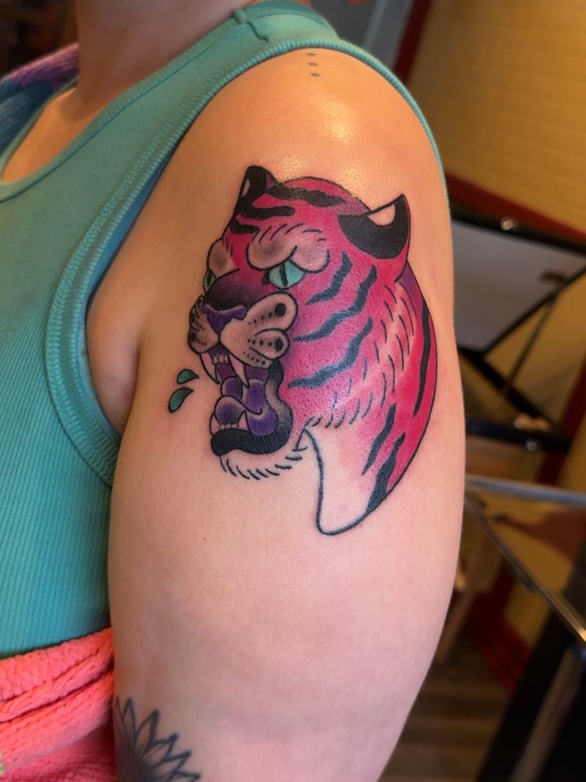 Tiger American traditional tattoo on the shoulder by 🐆Cam Feral Tattoos