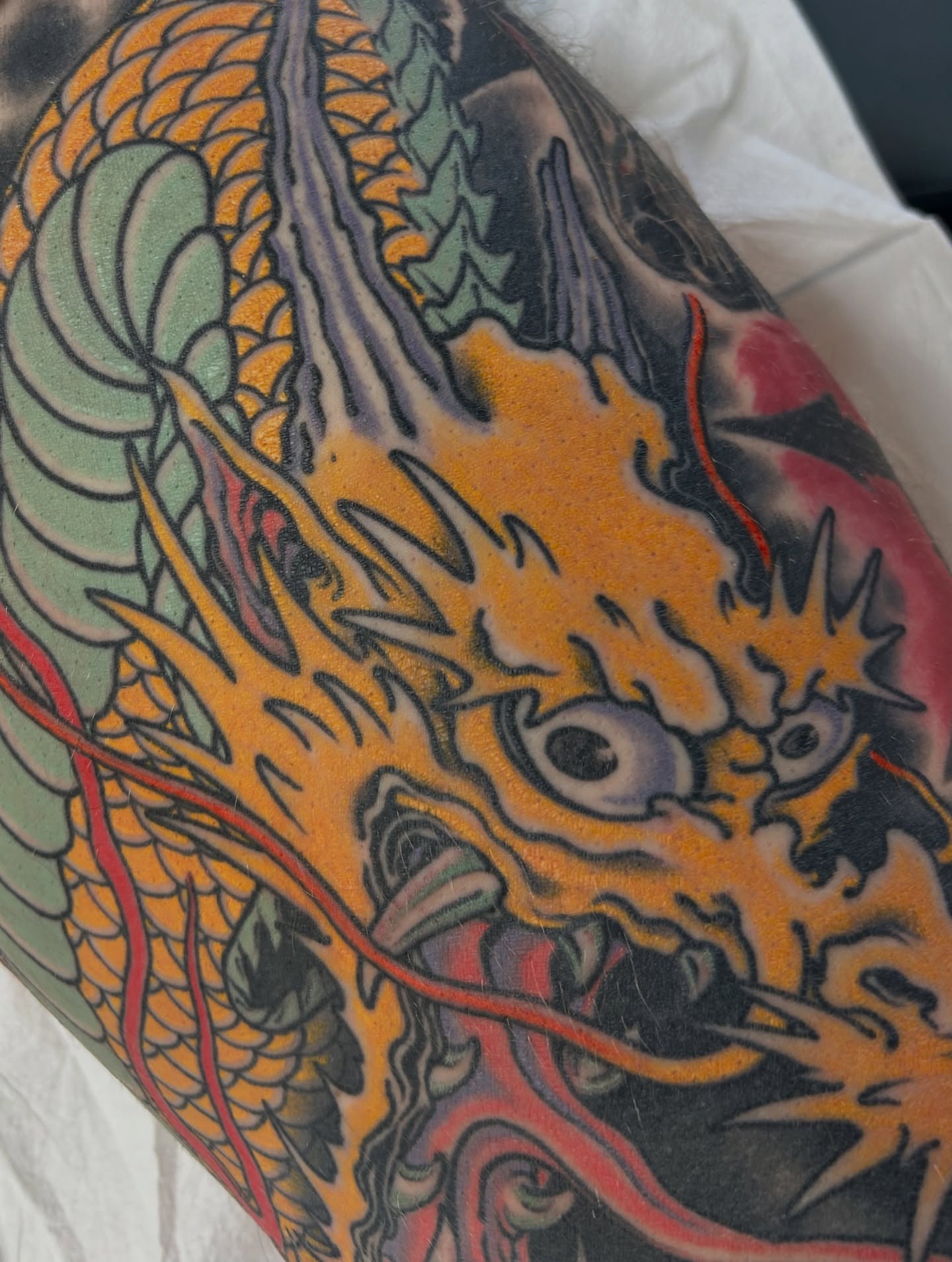 Dragon American traditional tattoo on the forearm by Craig Gardyan