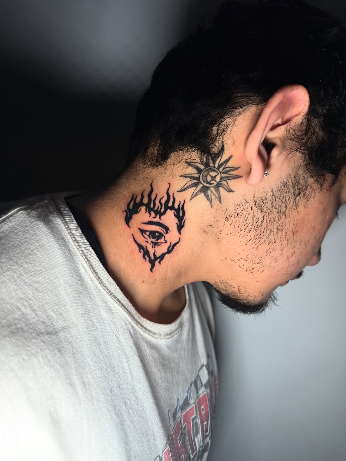 Eye and flame black and grey tattoo on the neck by 𝕸𝖔𝖓𝖎𝖖𝖚𝖊𝖊𝖓