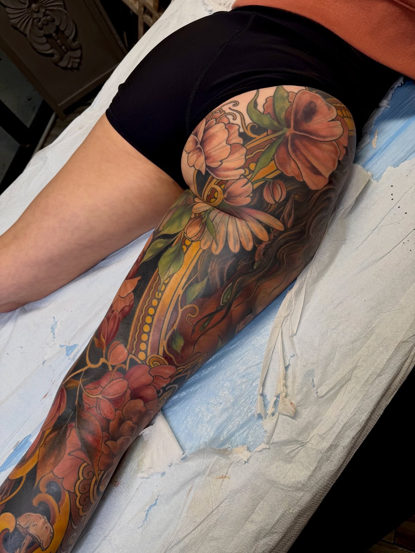 Floral bouquet new school tattoo on the leg by <
