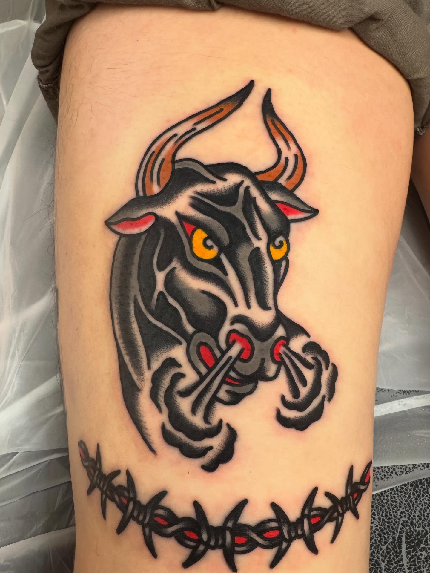Bull head American traditional tattoo on the thigh by Oldschool Tattooer