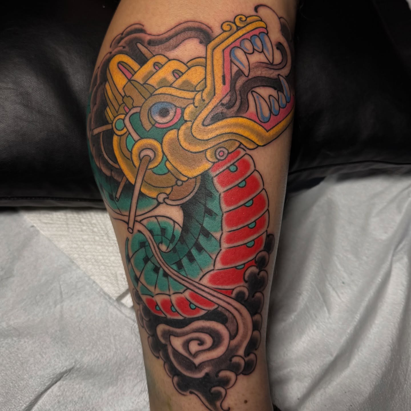Serpent American traditional tattoo on the forearm by Chris Orta
