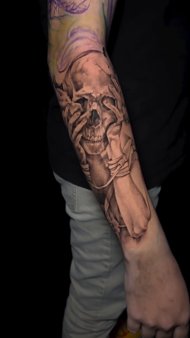 Skull covering eyes dark realism tattoo by Dani B.