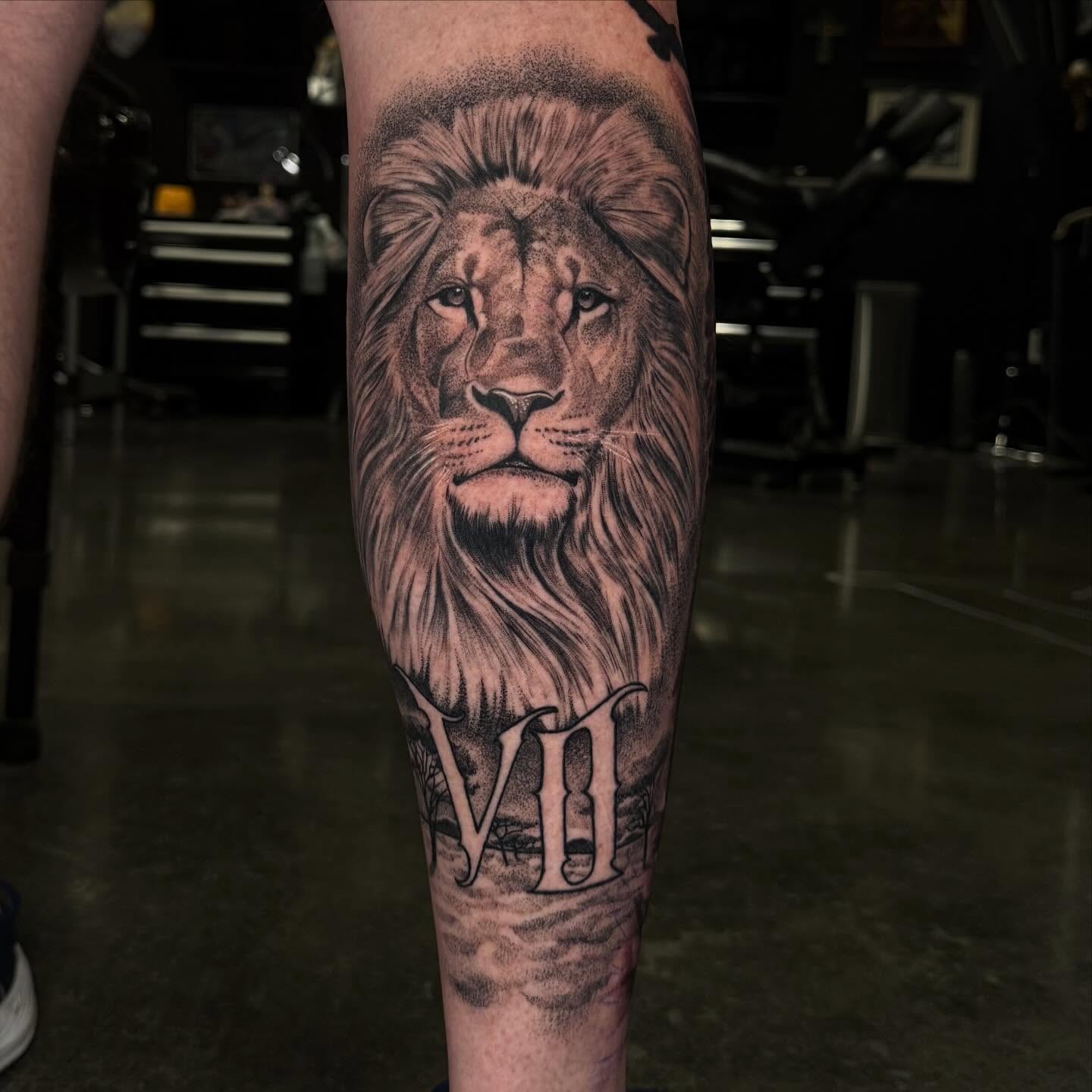 Lion realism tattoo on the forearm by Carlos Lujan