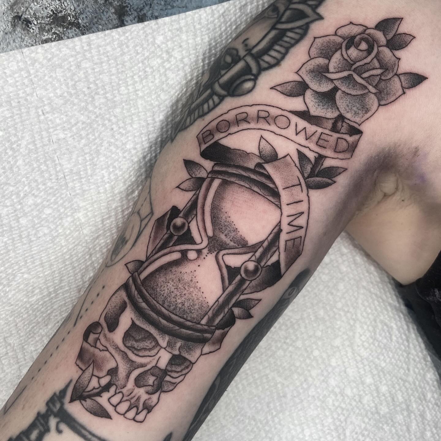 Timepiece and skull American traditional tattoo on the forearm by nicholas mcevoy, Boston, Massachusetts