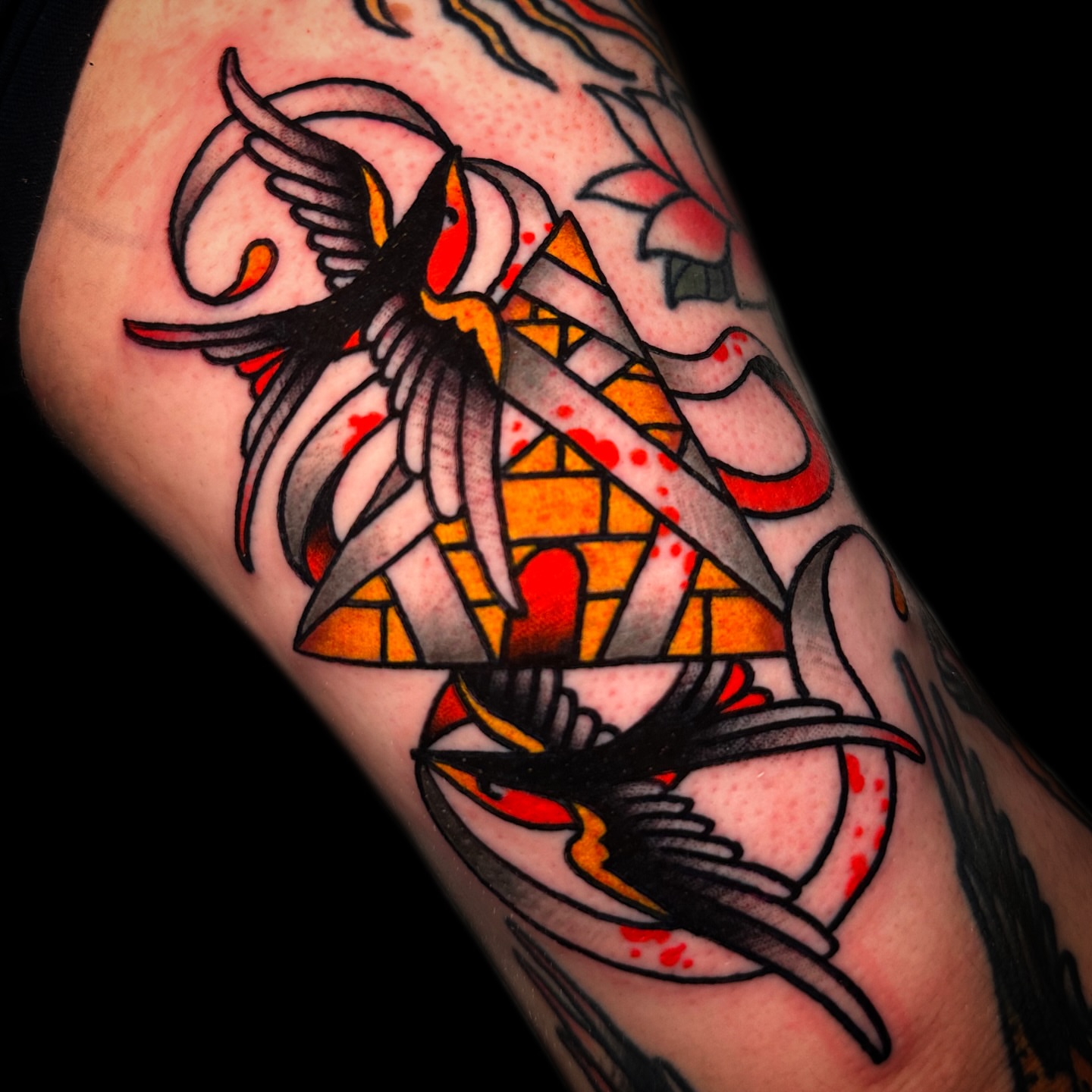 Swallows American traditional tattoo on the forearm by Danny Reis