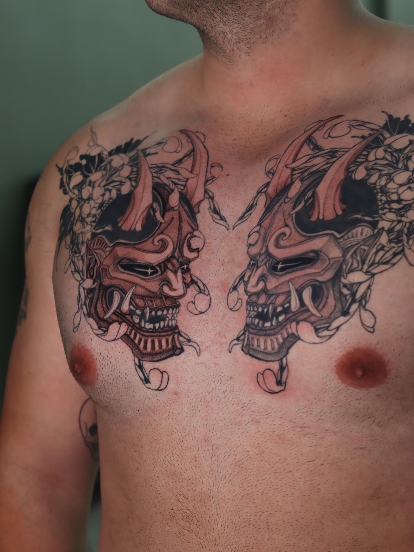Two samurai masks japanese irezumi tattoo on the chest by Melissa C, Phoenix, Arizona