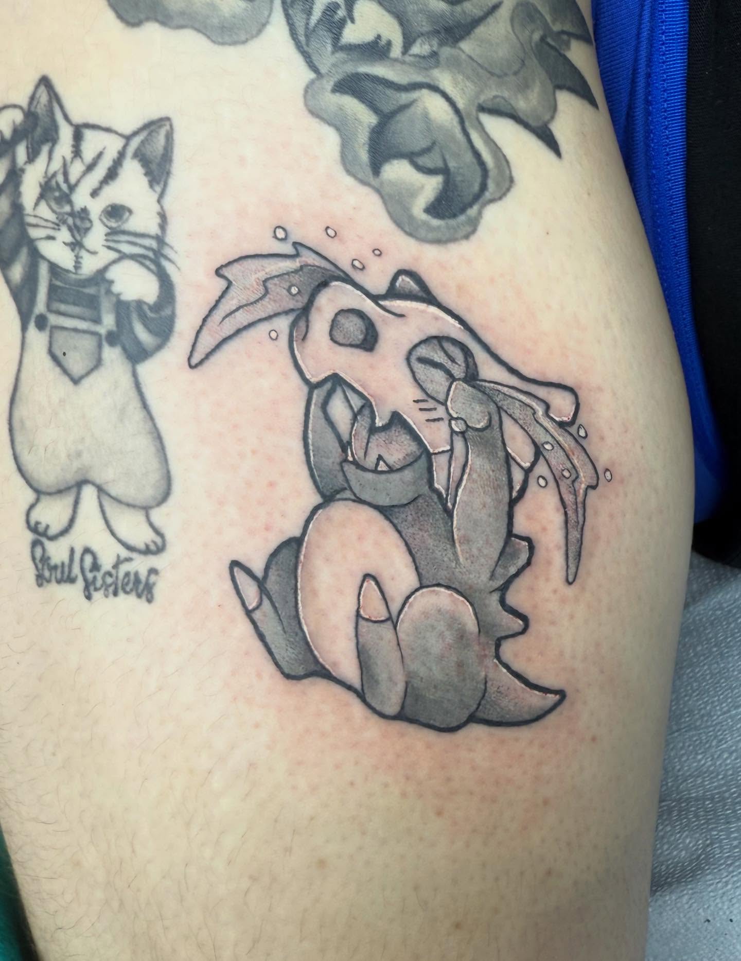 Cat black and grey tattoo on the thigh by Bry