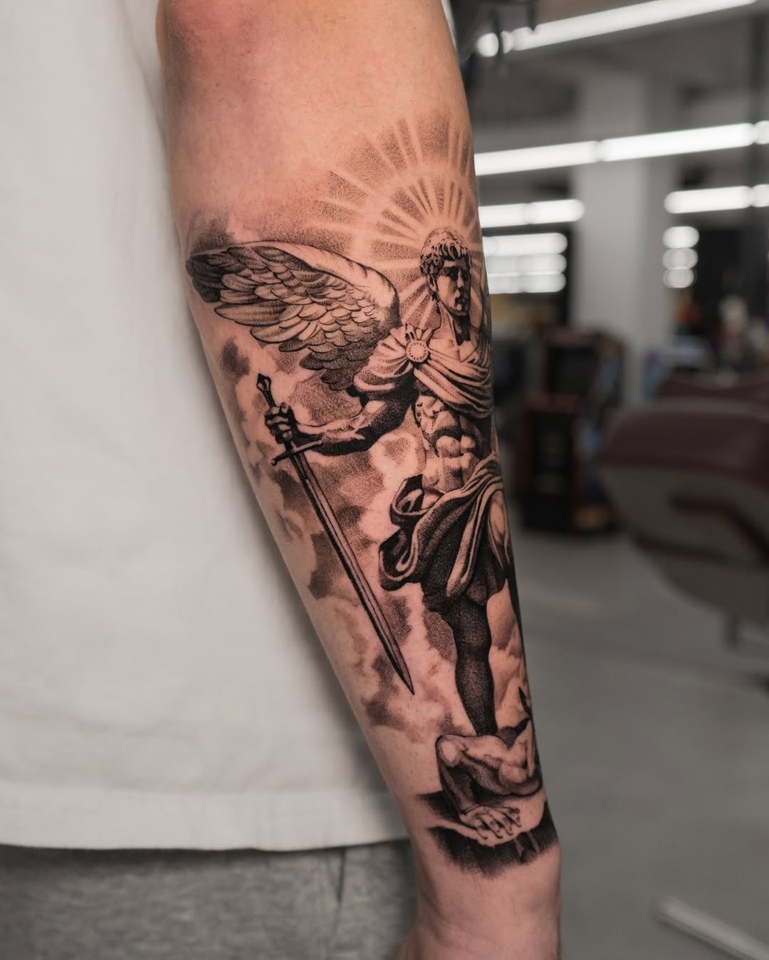 Archangel Michael with sword realism tattoo on the forearm by Mateo