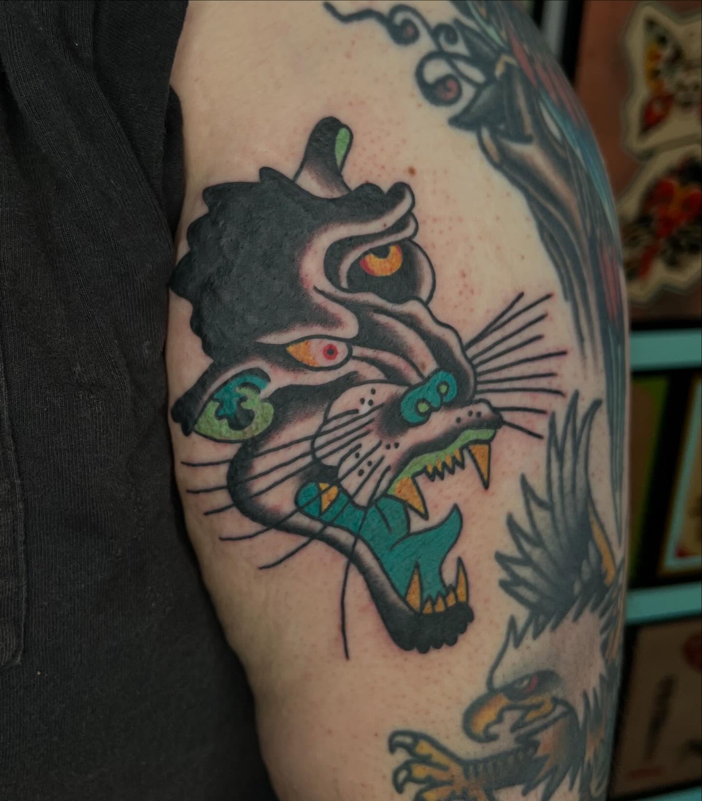 Panther American traditional tattoo on the forearm by Mikey Montoya