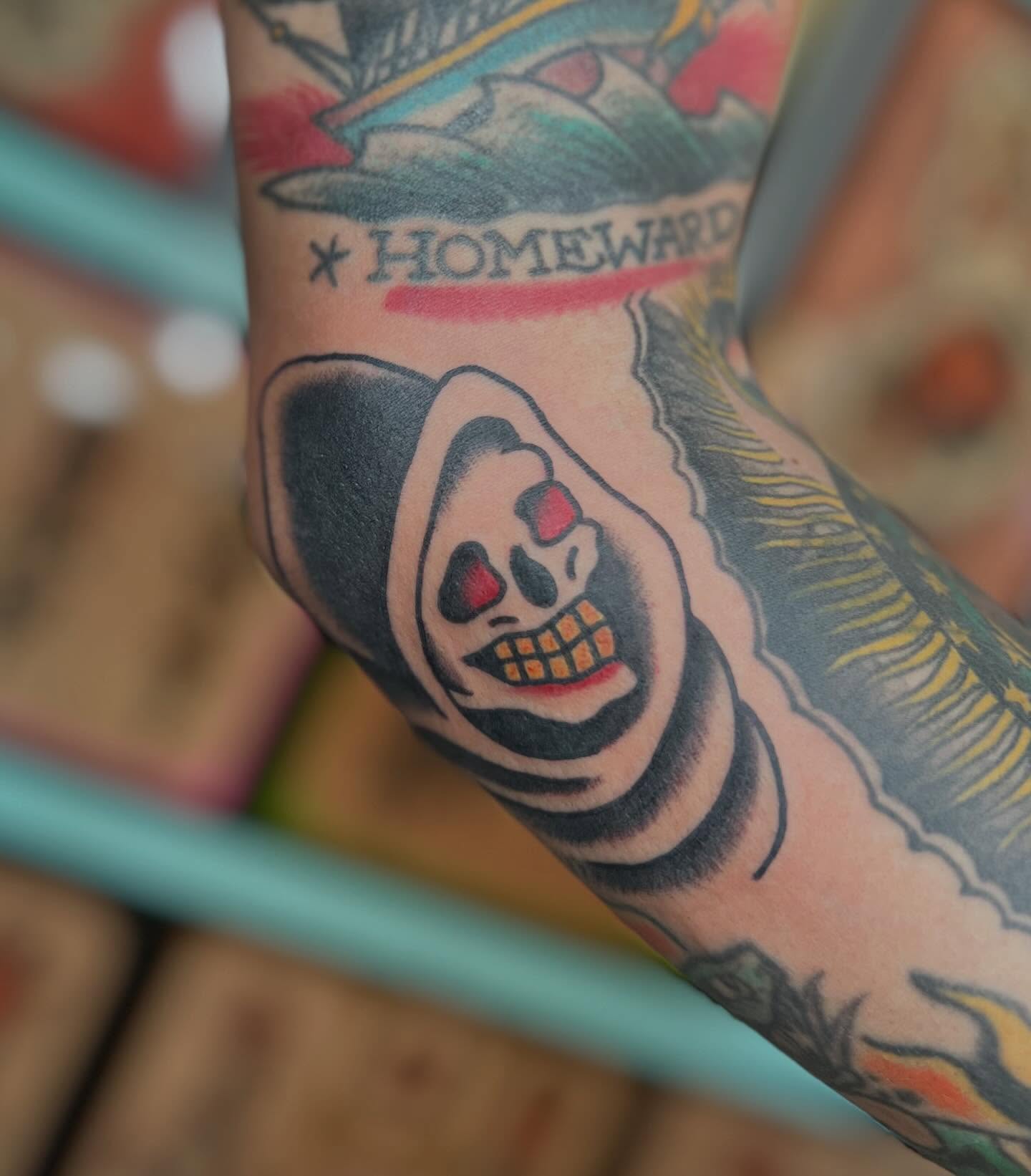 Skull American traditional tattoo on the forearm by Mikey Montoya