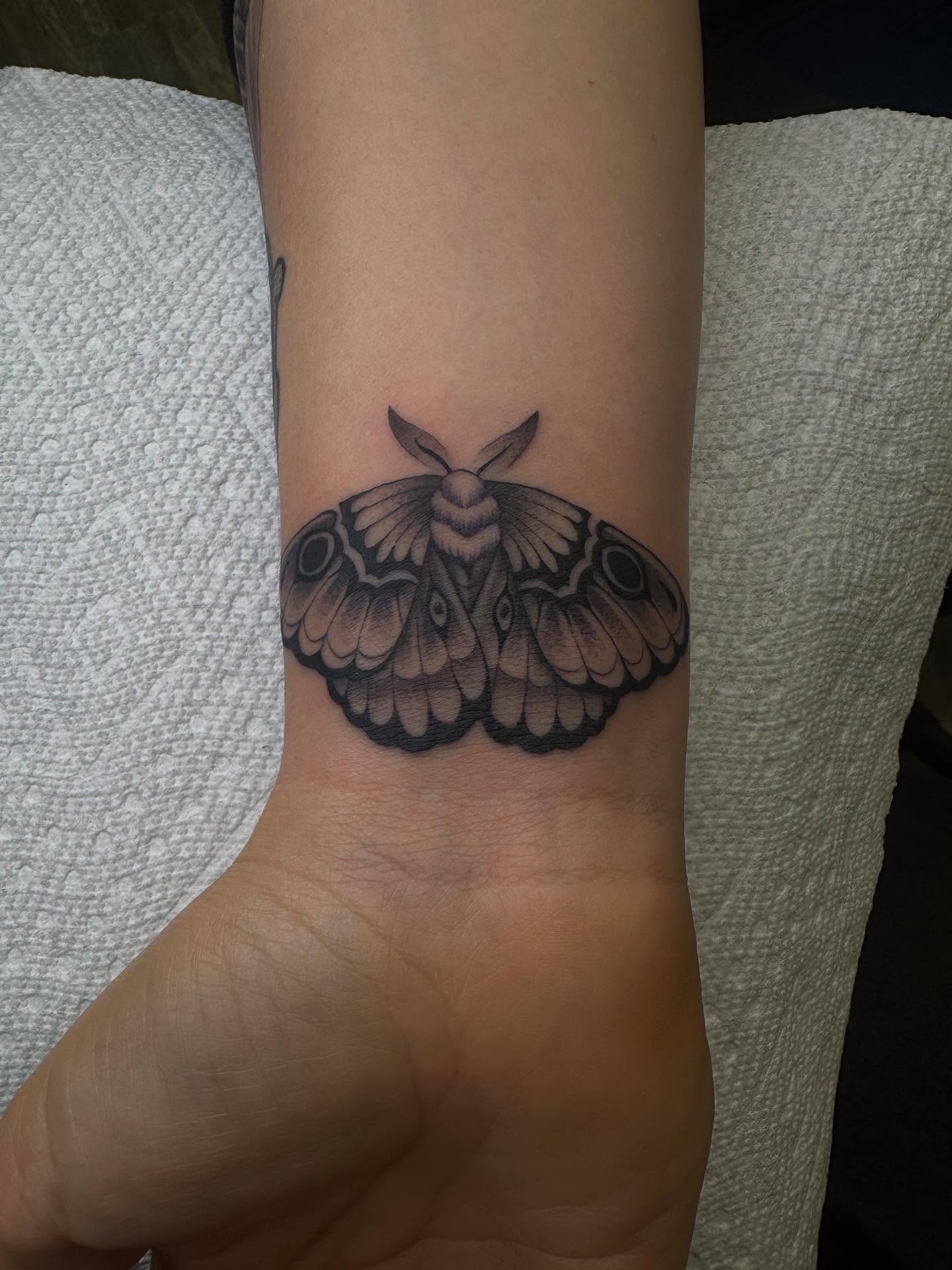 Moth black and grey tattoo on the forearm by Brandon Heredia, Vacaville, California