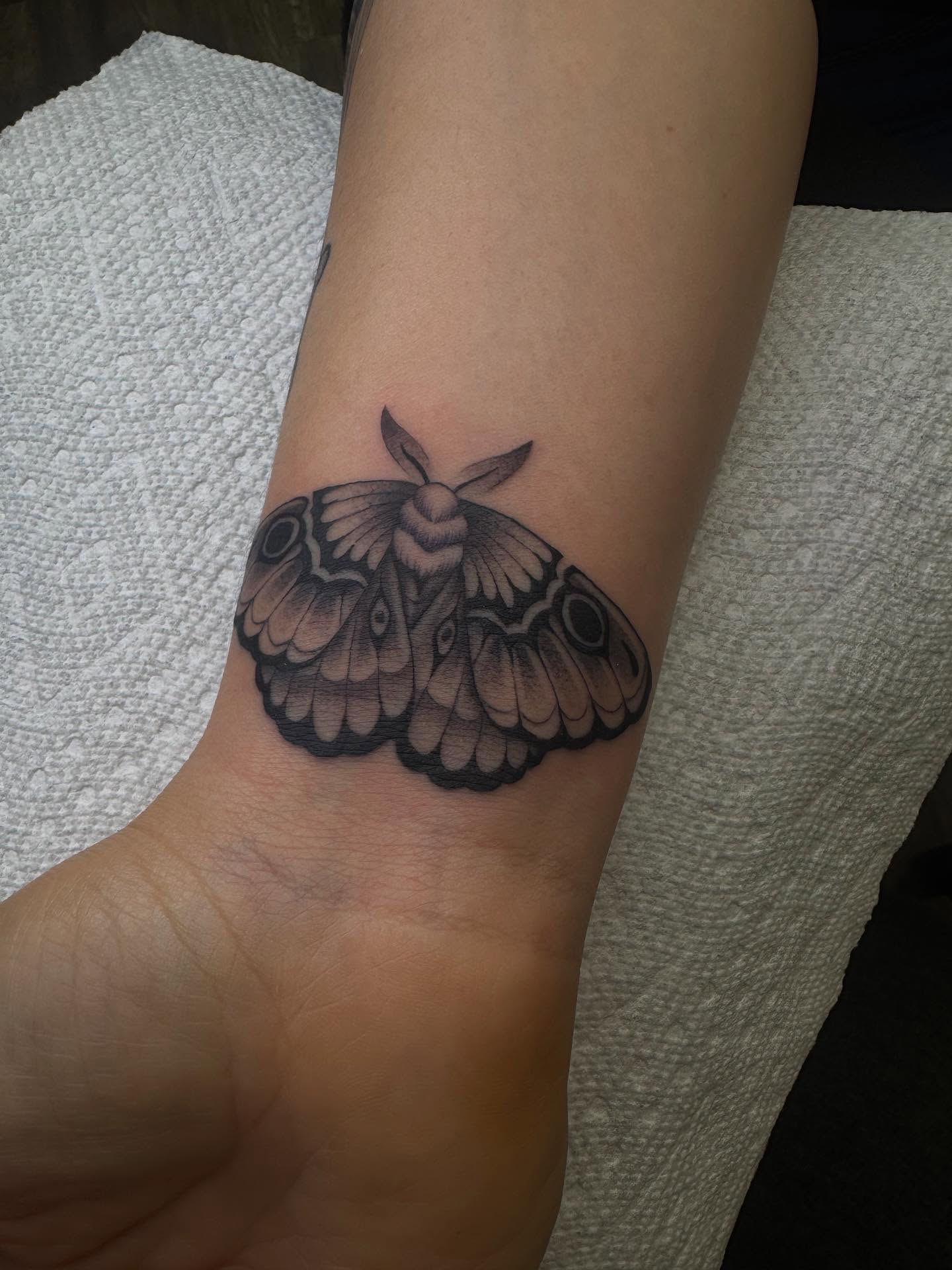 Moth black and grey tattoo on the forearm by Brandon Heredia, Vacaville, California