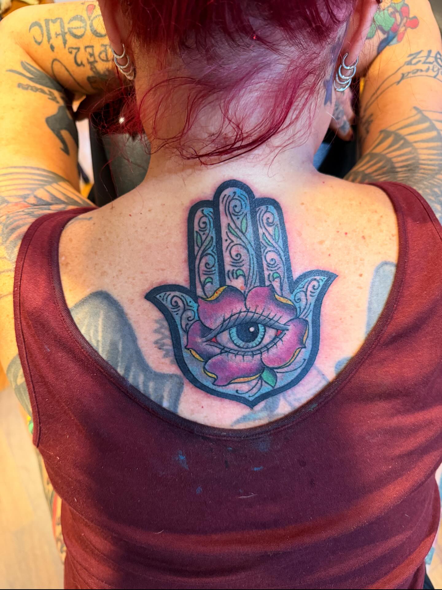 Hamsa hand with eye ornamental tattoo on the back by Mike Kepper