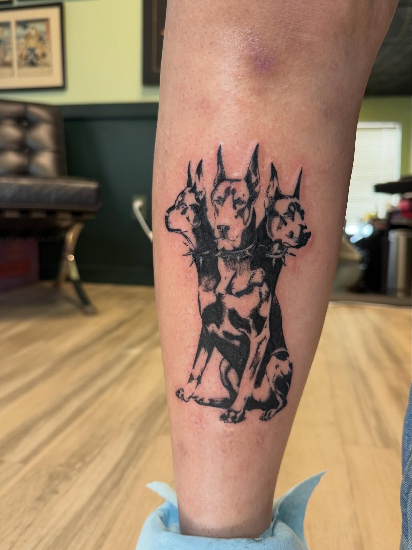 Dogs black and grey tattoo on the forearm by Taytum Marsing, Salt Lake City, Utah