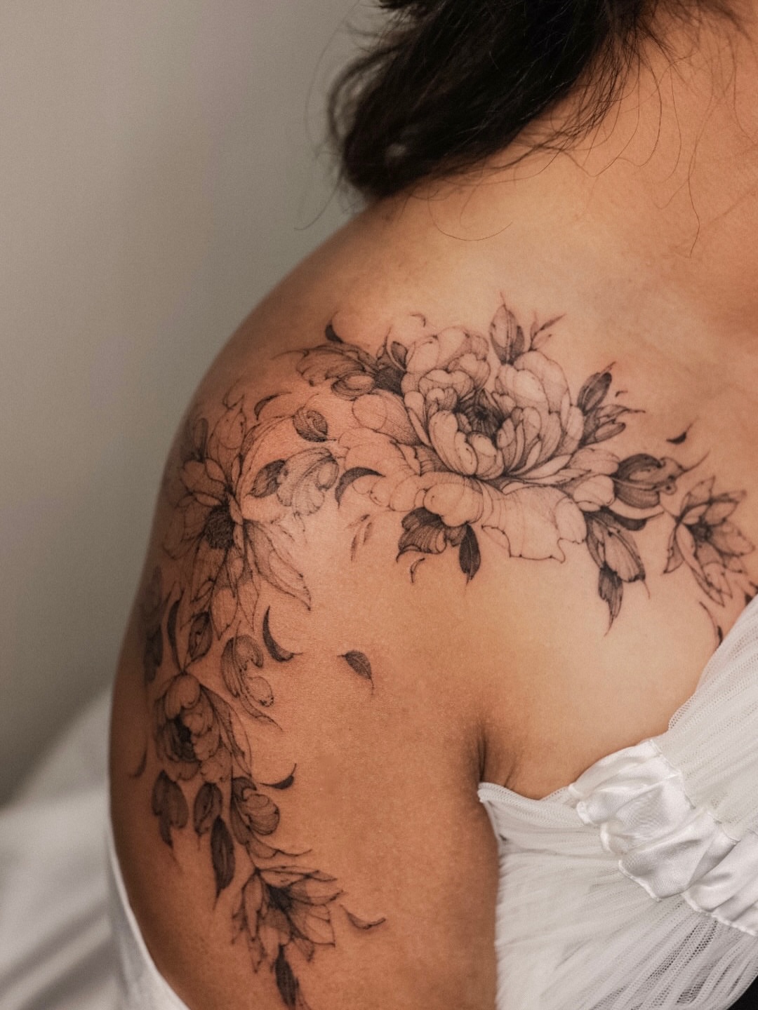Floral bouquet black and grey tattoo on the shoulder by Maria