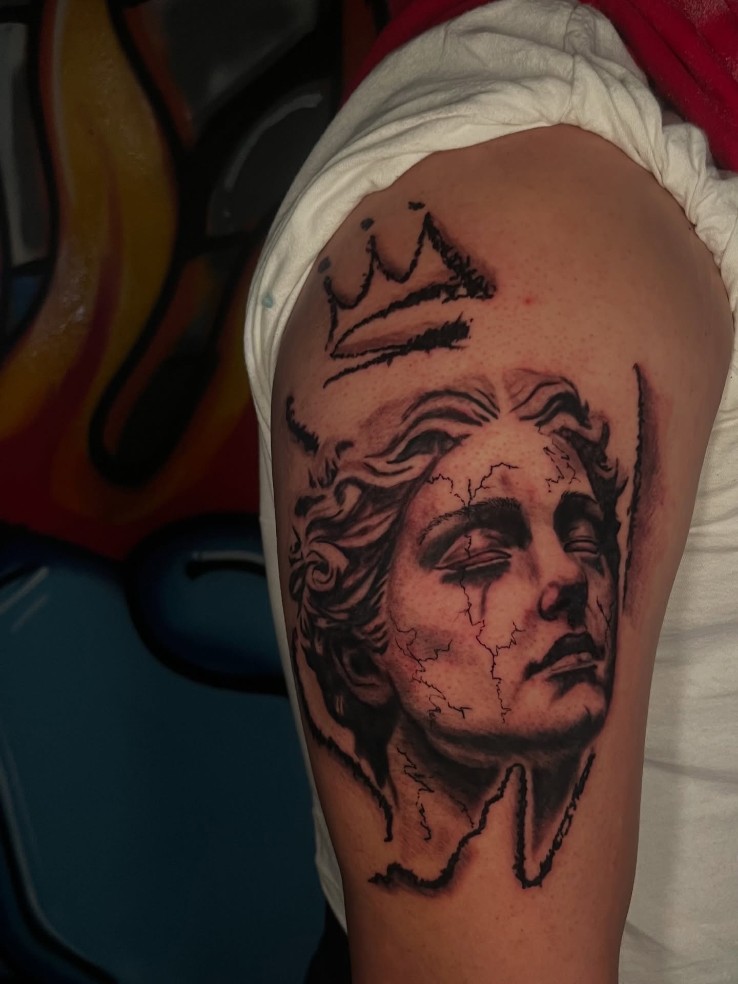 Portrait of a crowned figure realism tattoo on the shoulder by Unknwn Ink ⭐️