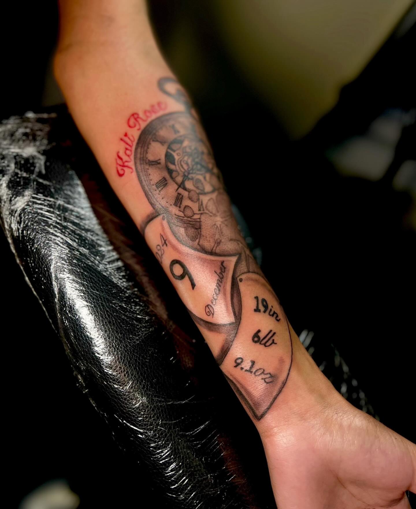 Clock and birth details black and grey tattoo on the forearm by @tattsbyleek